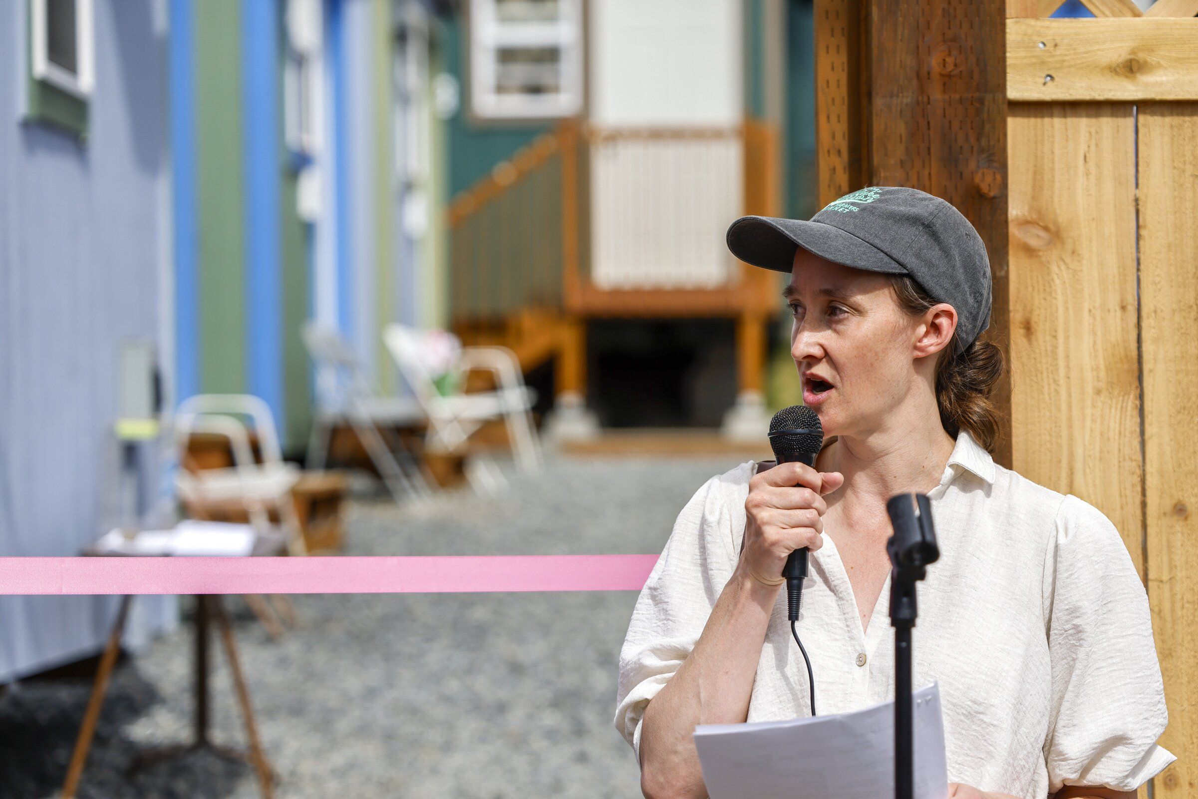Mayor Katie Wilson speaks at the grand opening of Seattle’s Brighton neighborhood Nickelsville tiny house village in June. (Andrew Burke-Stevenson / The Seattle Times)