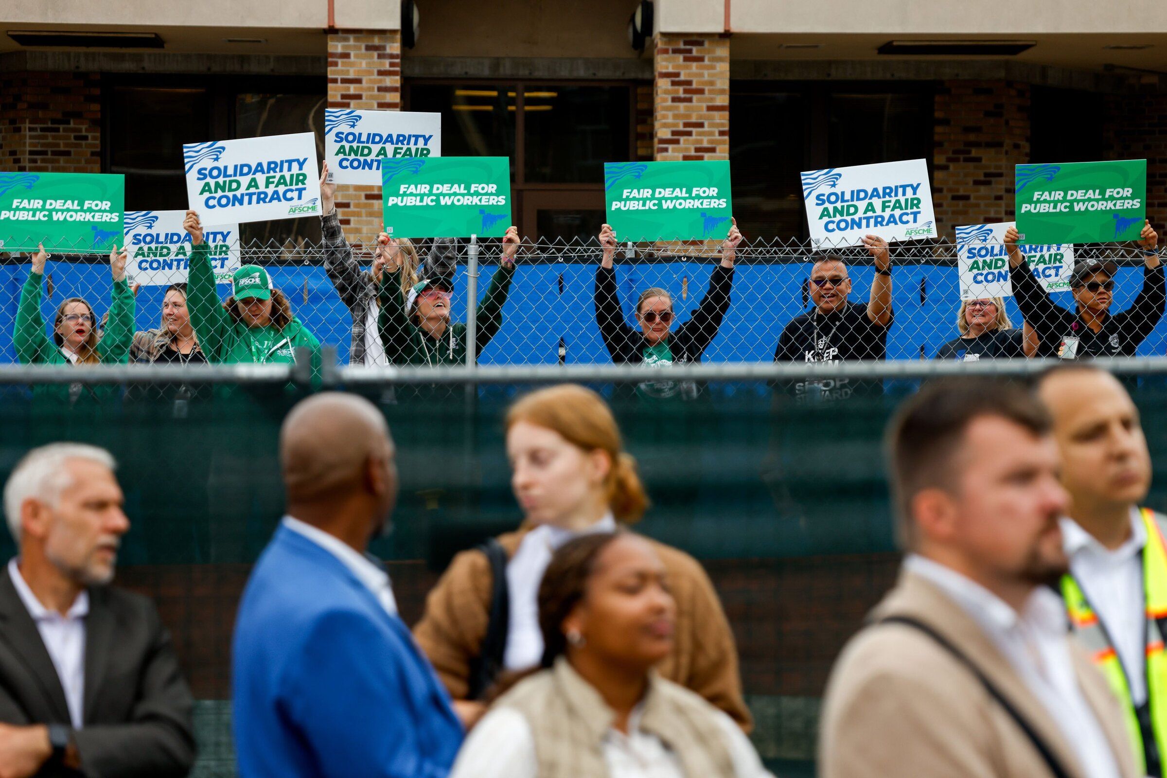 Western State Hospital workers with the Washington Federation of State Employees hold signs and chant last month at the forensic state hospital that is under construction at the Western State Hospital campus in Lakewood. (Andrew Burke-Stevenson / The Seattle Times)