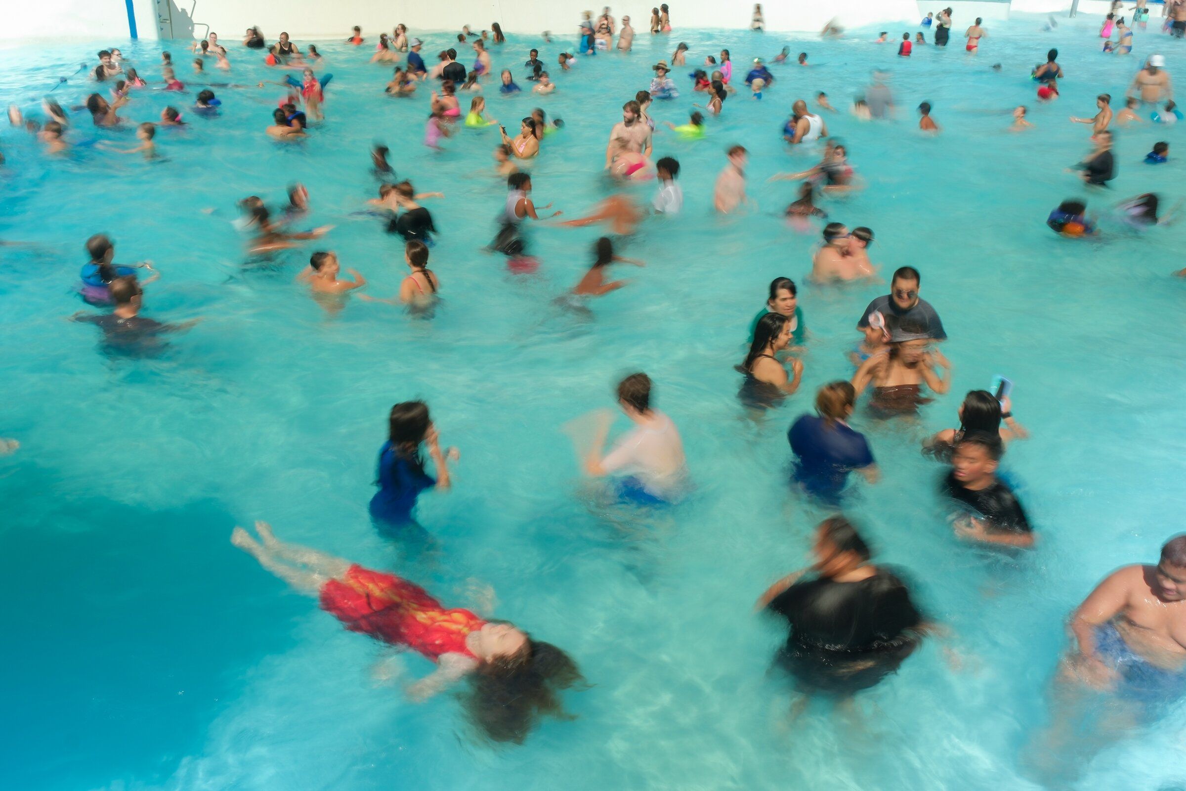 Visitors float in the wave pool at Wild Waves in Federal Way in late August. (Genna Martin / Special to The Seattle Times)