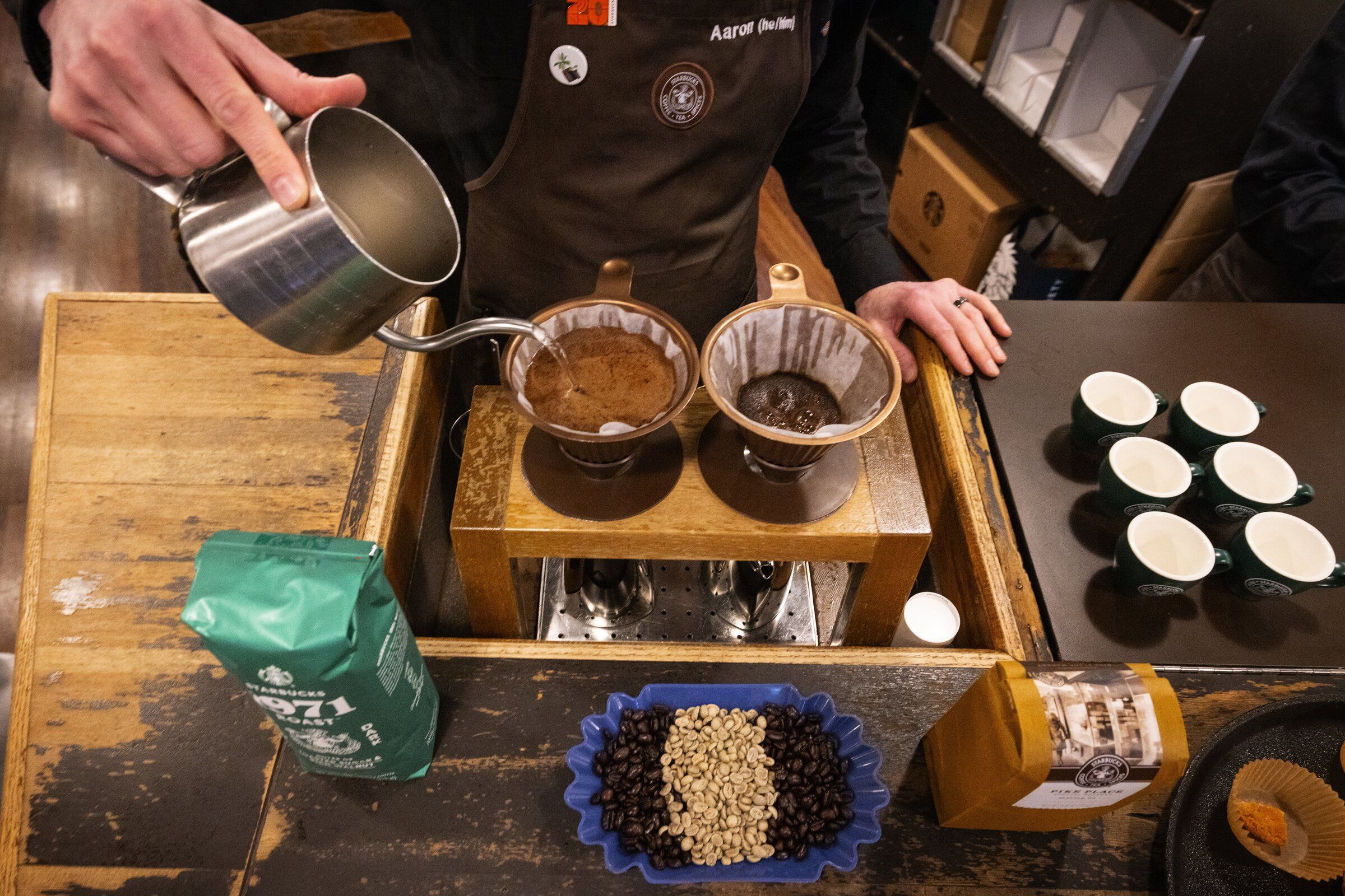 A coffee pour-over is done at a Seattle Starbucks store in June. (Ken Lambert / The Seattle Times)