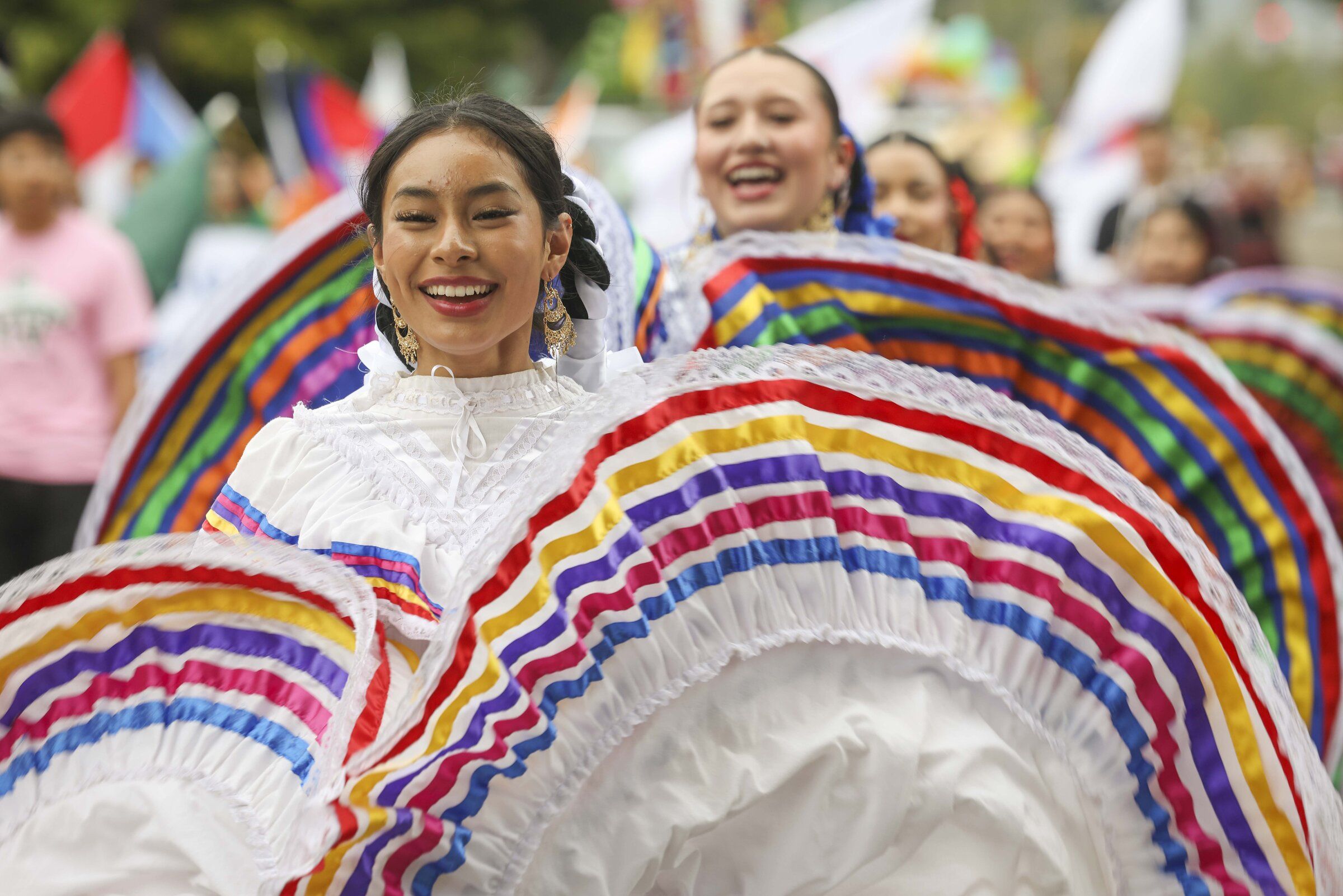 Lillian Erandi Moto, 16, dances with Mount Vernon School District Mariachi and Folklorico during the Fiestas Patrias parade on Saturday in Seattle’s South Park neighborhood. (Ivy Ceballo / The Seattle Times)