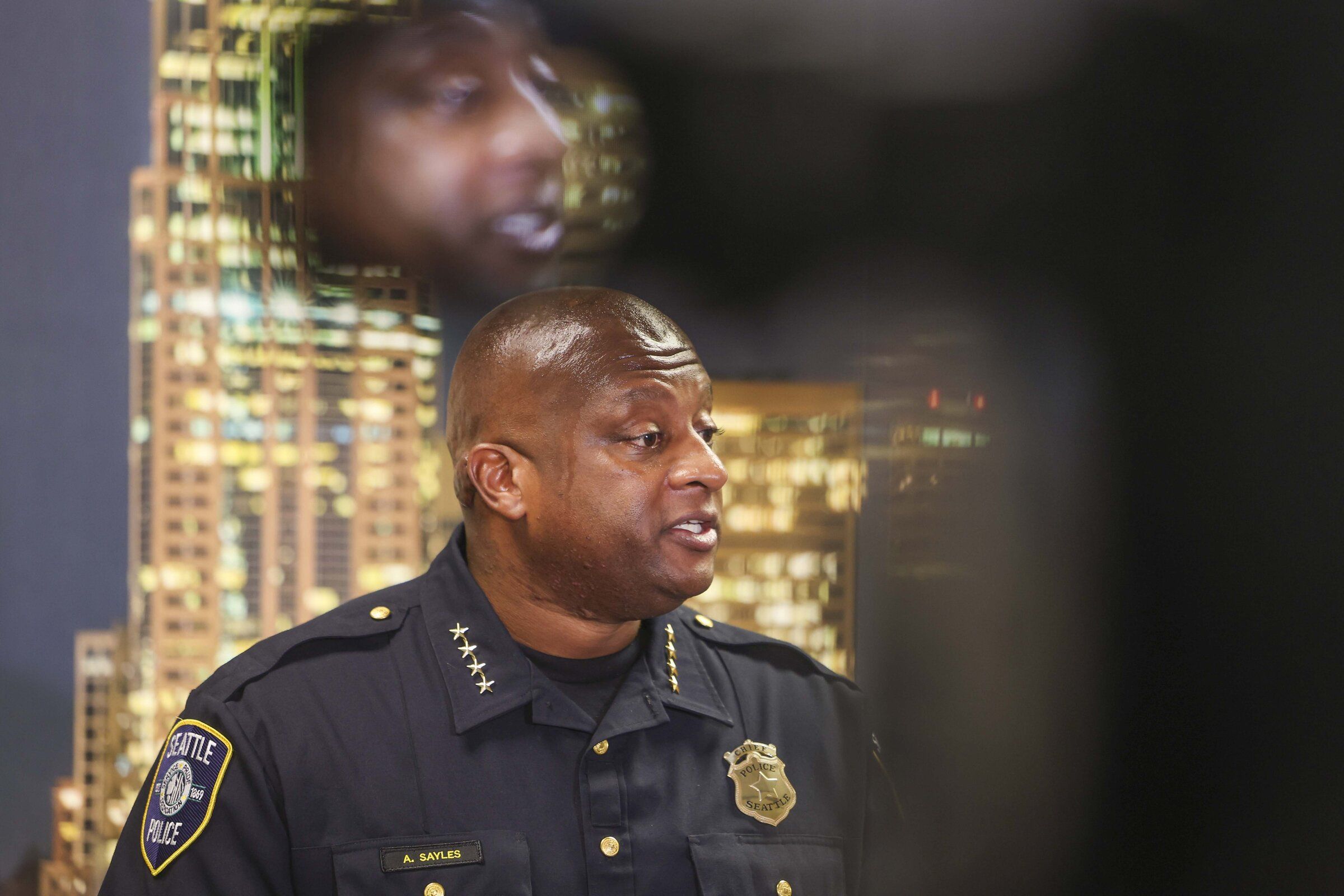 Interim Chief Andre Sayles speaks with members of the media during a new conference at Seattle Police Department’s West Precinct community room in Seattle on Sept. 7. (Ivy Ceballo / The Seattle Times)