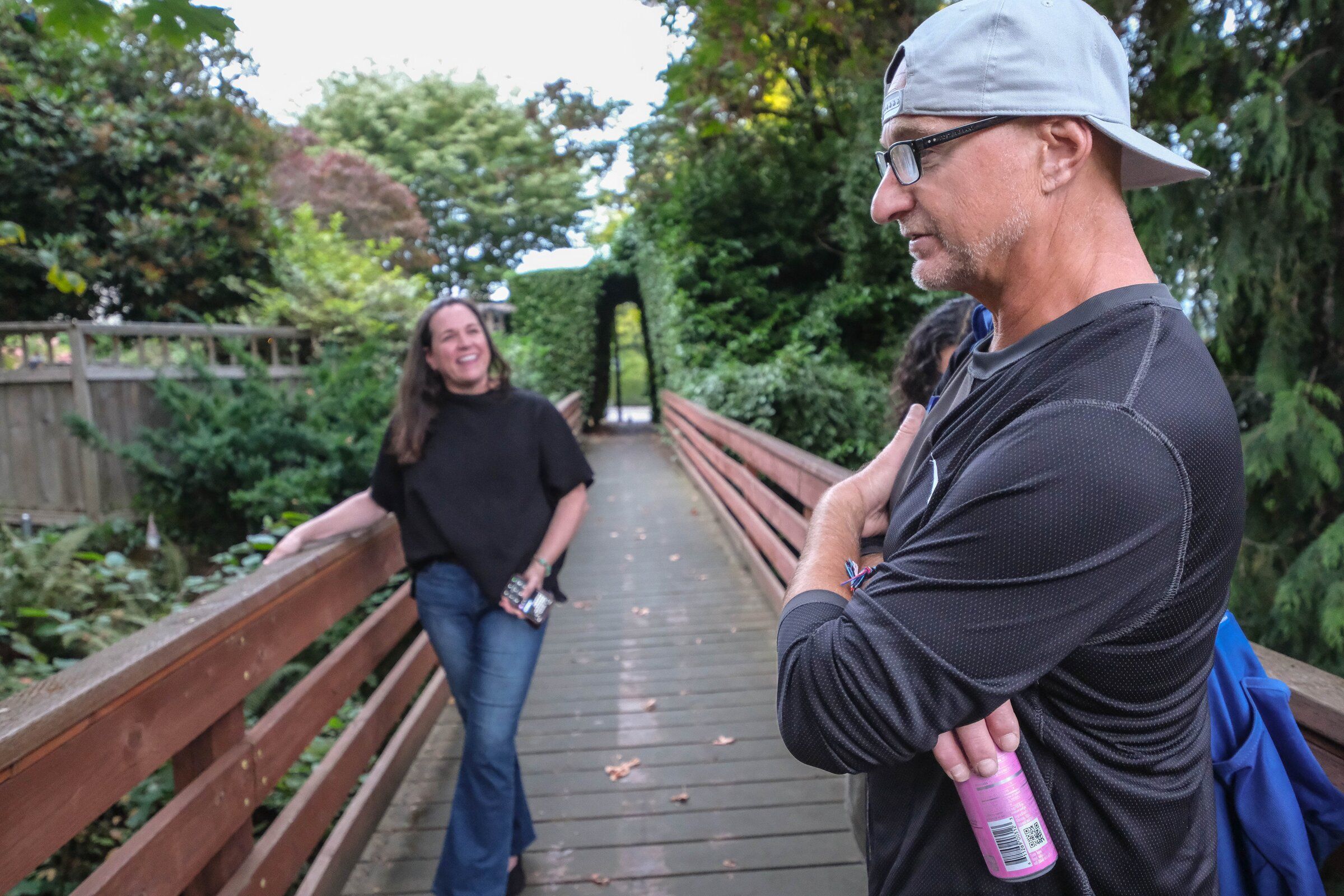 Rob Christoff, right, was Maureen Horgan’s co-conspirator in placing dozens of gnomes in this Madrona ravine, which has become known as the Valley of the Gnomes. (Dean Rutz / The Seattle Times)