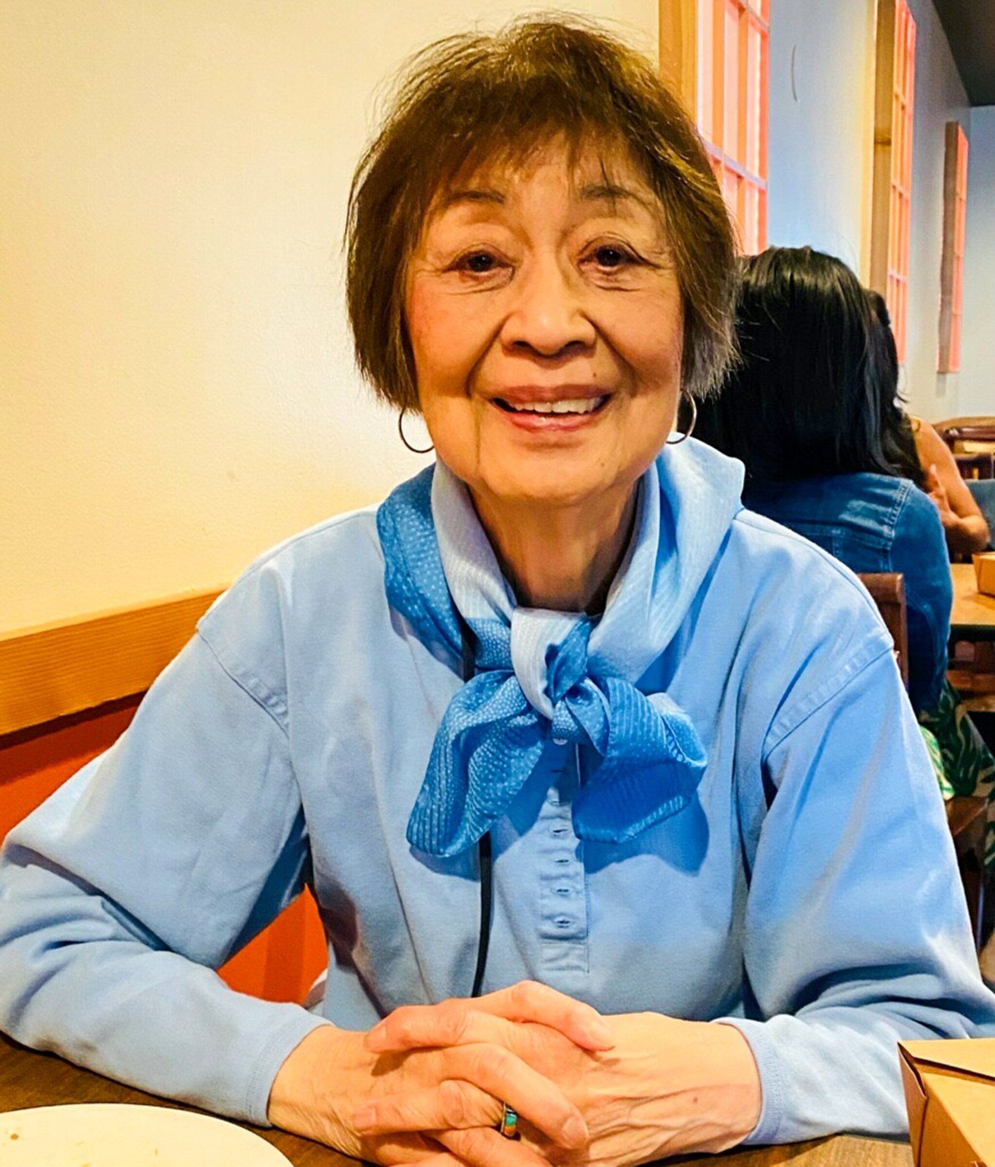 Dolores Sibonga poses for a portrait at a meal with family in 2025. (Courtesy Randi Sibonga)