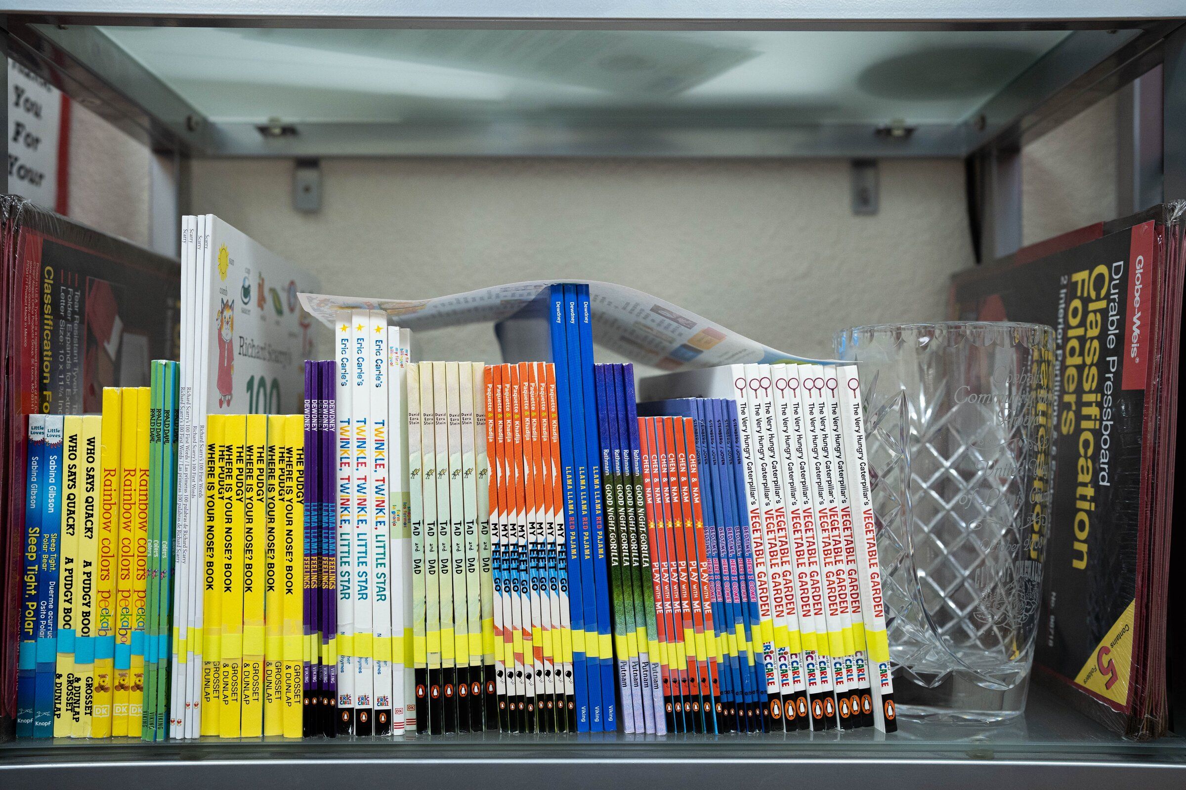 Books from the Dolly Parton Imagination Library program sit on a shelf at the United Way of Lewis County branch in Chehalis. (Otto Rabe / The Chronicle)