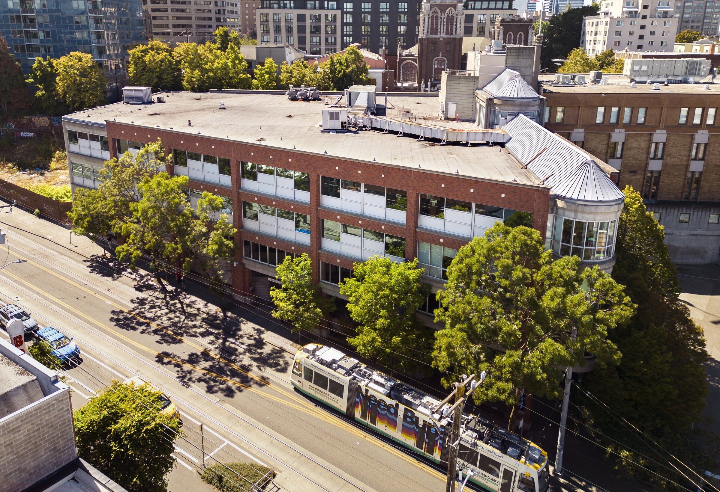 A First Hill street car heads past the former Polyclinic building at 1145 Broadway, which King County picked as the site of its new mental health crisis center. (Ellen M. Banner / The Seattle Times, 2025)