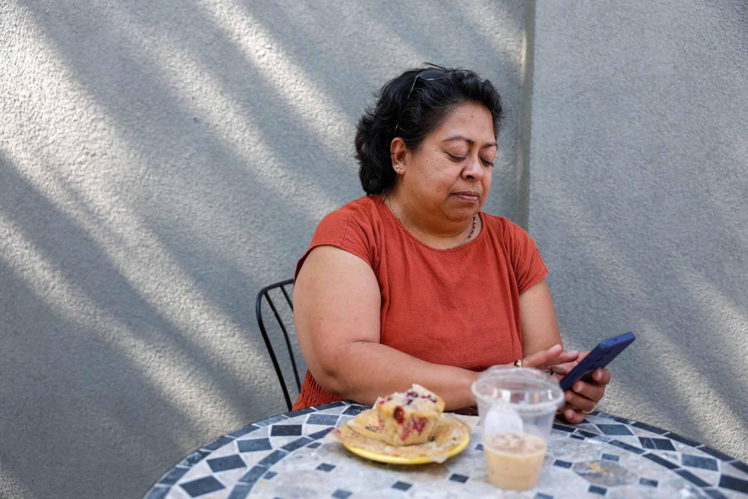 State House candidate Stacey Willoughby checks messages at a cafe in Cashmere. (Andrew Burke-Stevenson / The Seattle Times)
