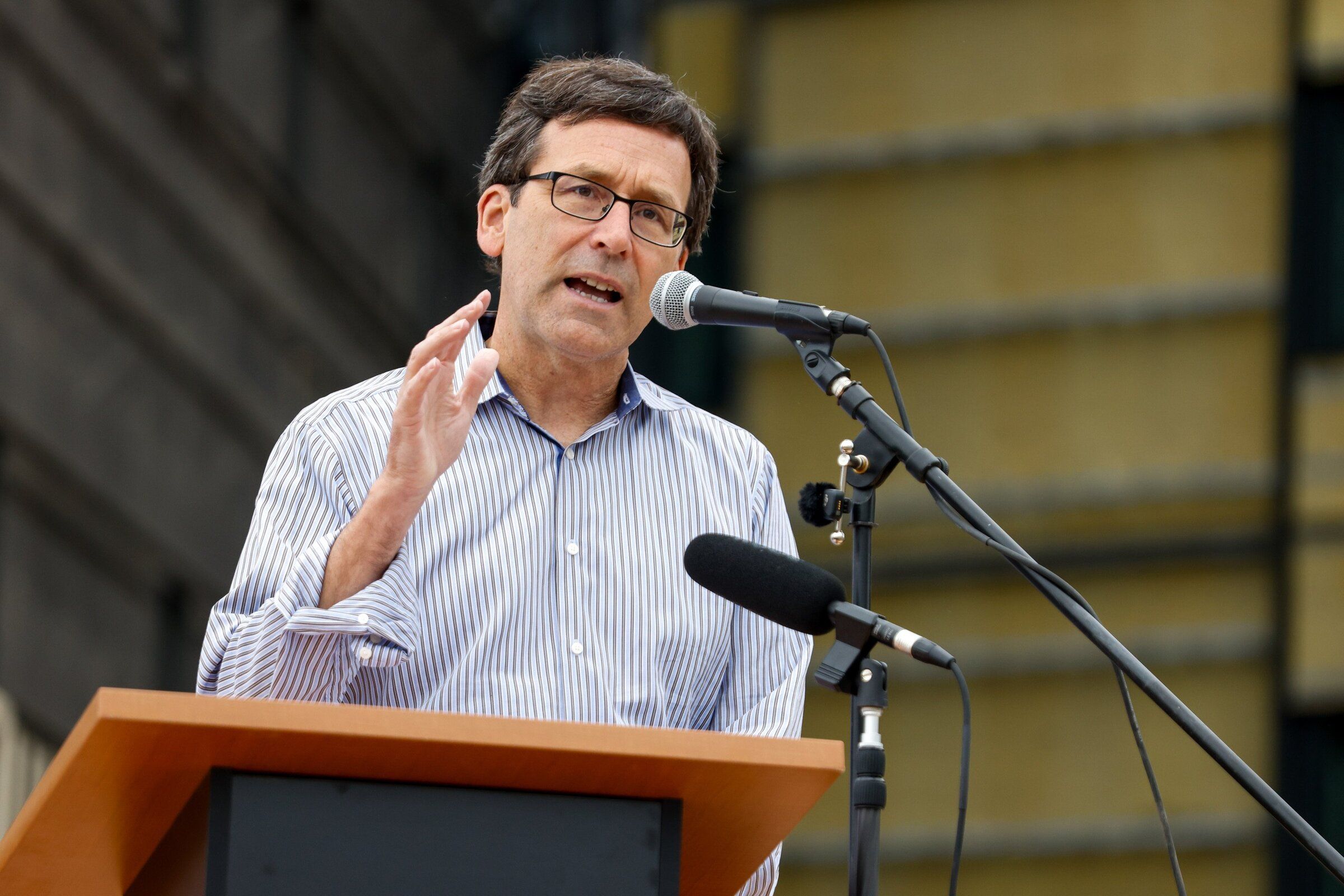 Gov. Bob Ferguson speaks before signing the final structural beam at the under-construction forensic state hospital at the Western State Hospital campus in Lakewood, Pierce County, on Aug. 28. (Andrew Burke-Stevenson / The Seattle Times)
