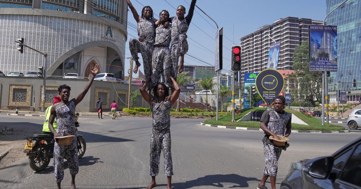 Street acrobats entertain motorists stuck in the Kenyan capital’s notorious traffic