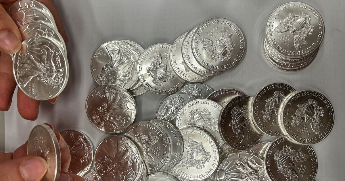A tip about a swerving van leads police to 66,000 US silver coins in a fraud case
