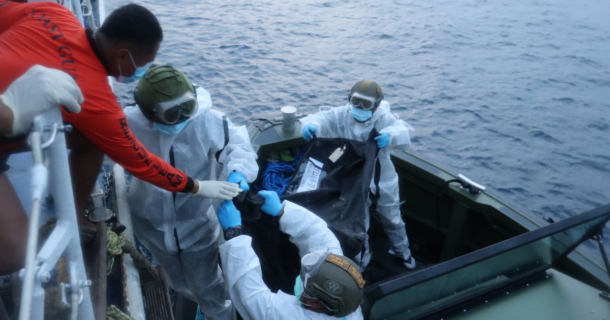 Bodies from charred Philippine ferry arrive at port after fire that killed at least 35