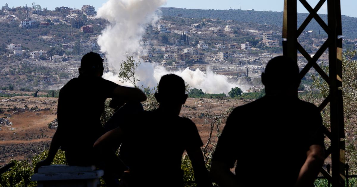 Residents of southern Lebanon gather to watch Israeli drones drop explosives on their village