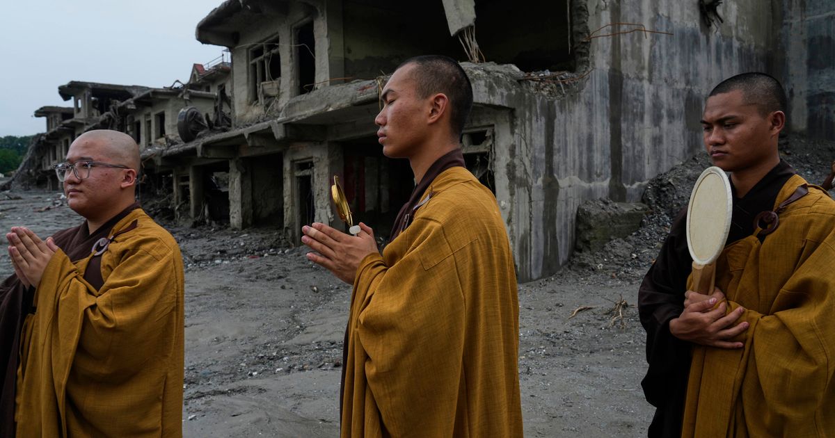 Nepal holds a day of mourning after floods kill at least 1,300 people