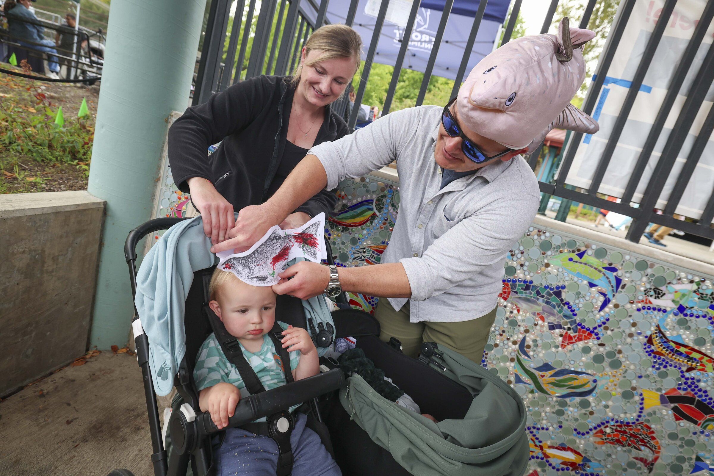 The Digulla family: from left, Kim, 1-year-old Jonah, Josh and Jonah’s younger brother, Luke, who is 6 weeks old and lying in a stroller. They are visiting the salmon-viewing platform at the Issaquah Salmon Hatchery. (Ivy Sebayo / The Seattle Times)