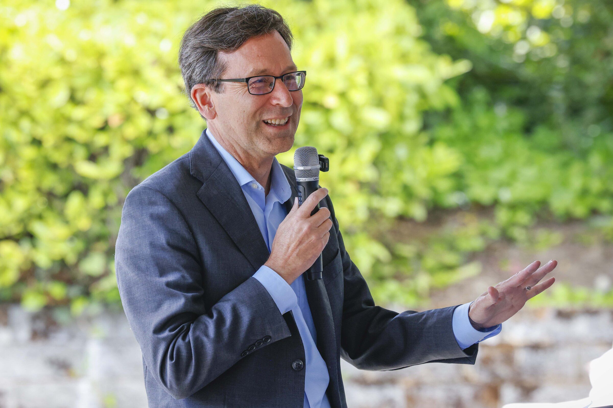 Gov. Bob Ferguson speaks at the grand opening of a Nimo Early Learning Center and Zaif Wellness Center on May 21 in Tukwila. (Ivy Ceballo / The Seattle Times)