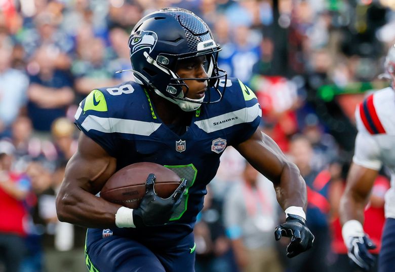 Seattle Seahawks running back Jadarian Price rushes against the New England Patriots, Sept. 9, 2026, in Seattle. (Jennifer Buchanan / The Seattle Times)