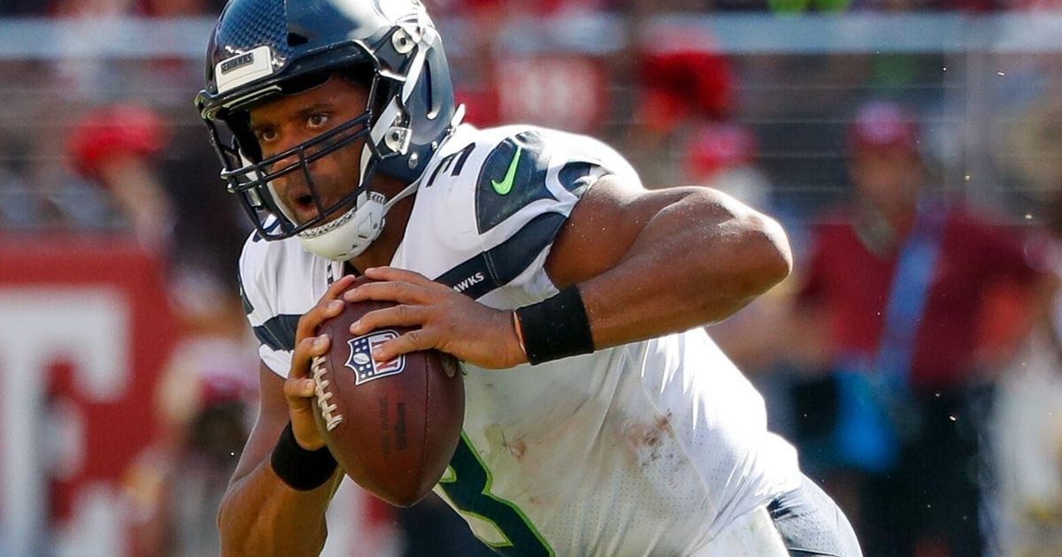 Russell Wilson wears 49ers hat, jokes about owning the team