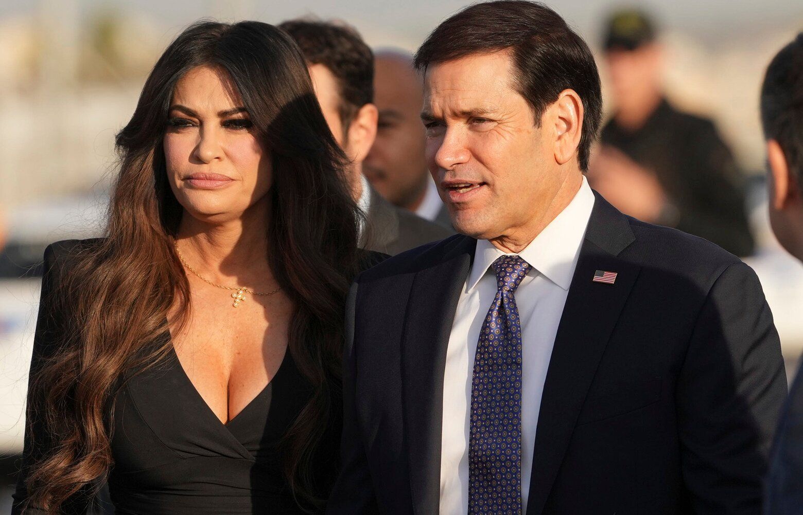 U.S. Secretary of State Marco Rubio, center, and U.S. Ambassador to Greece Kimberly Guilfoyle stand at Eleftherios Venizelos International Airport near Athens,