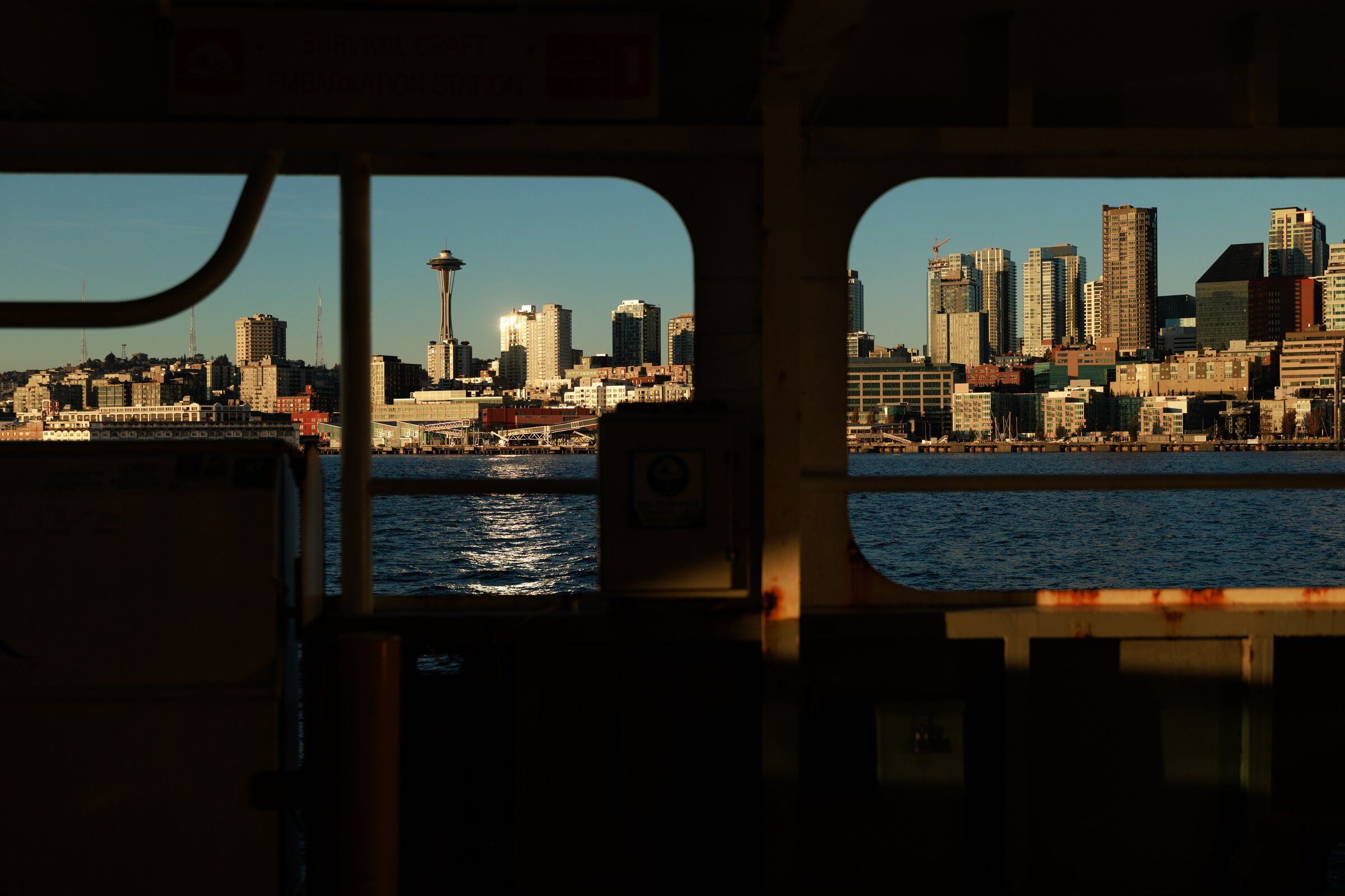 The Seattle skyline, seen from the Seattle-Bainbridge ferry, is illuminated with evening light on Oct 7. (Erika Schultz / The Seattle Times)