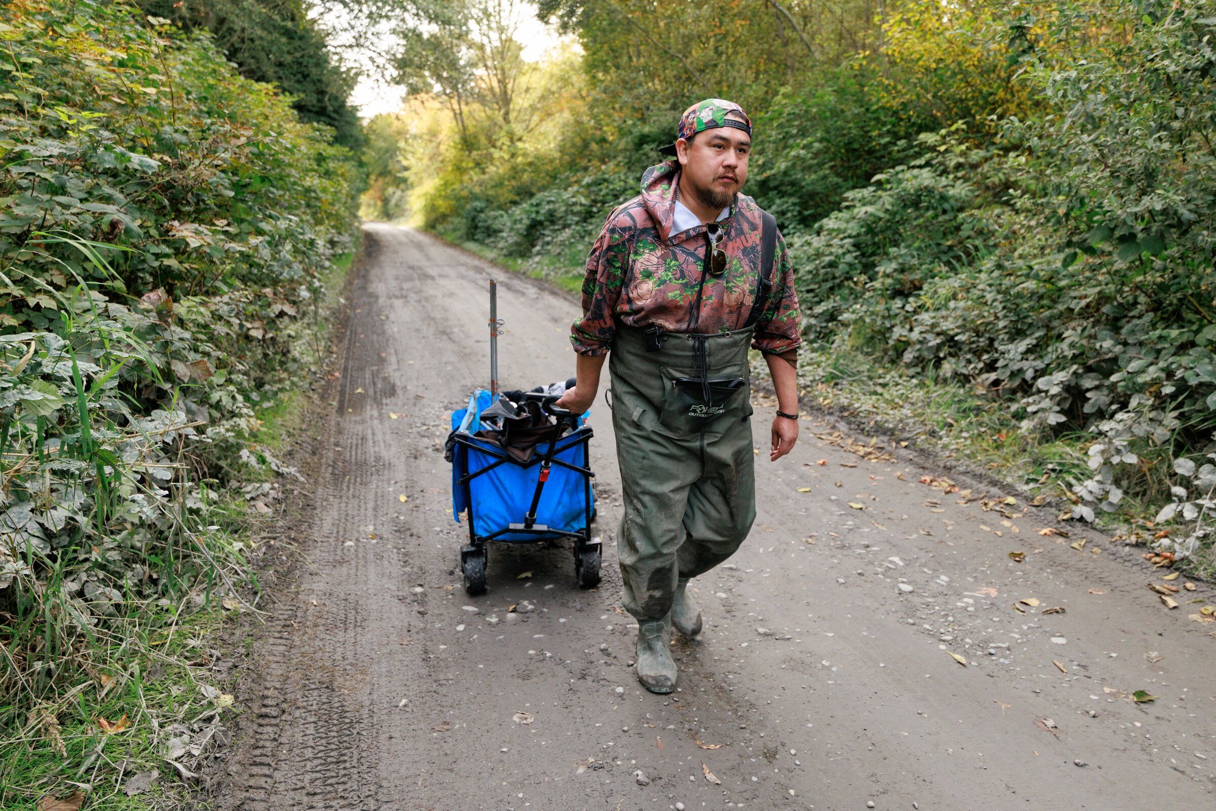 Travis Francis brings fish home to his family from the Elwha River on Tuesday. Francis says the fish are larger this year, and since the dam removal he has seen more salmon species returning to the river. (Erika Schultz / The Seattle Times)