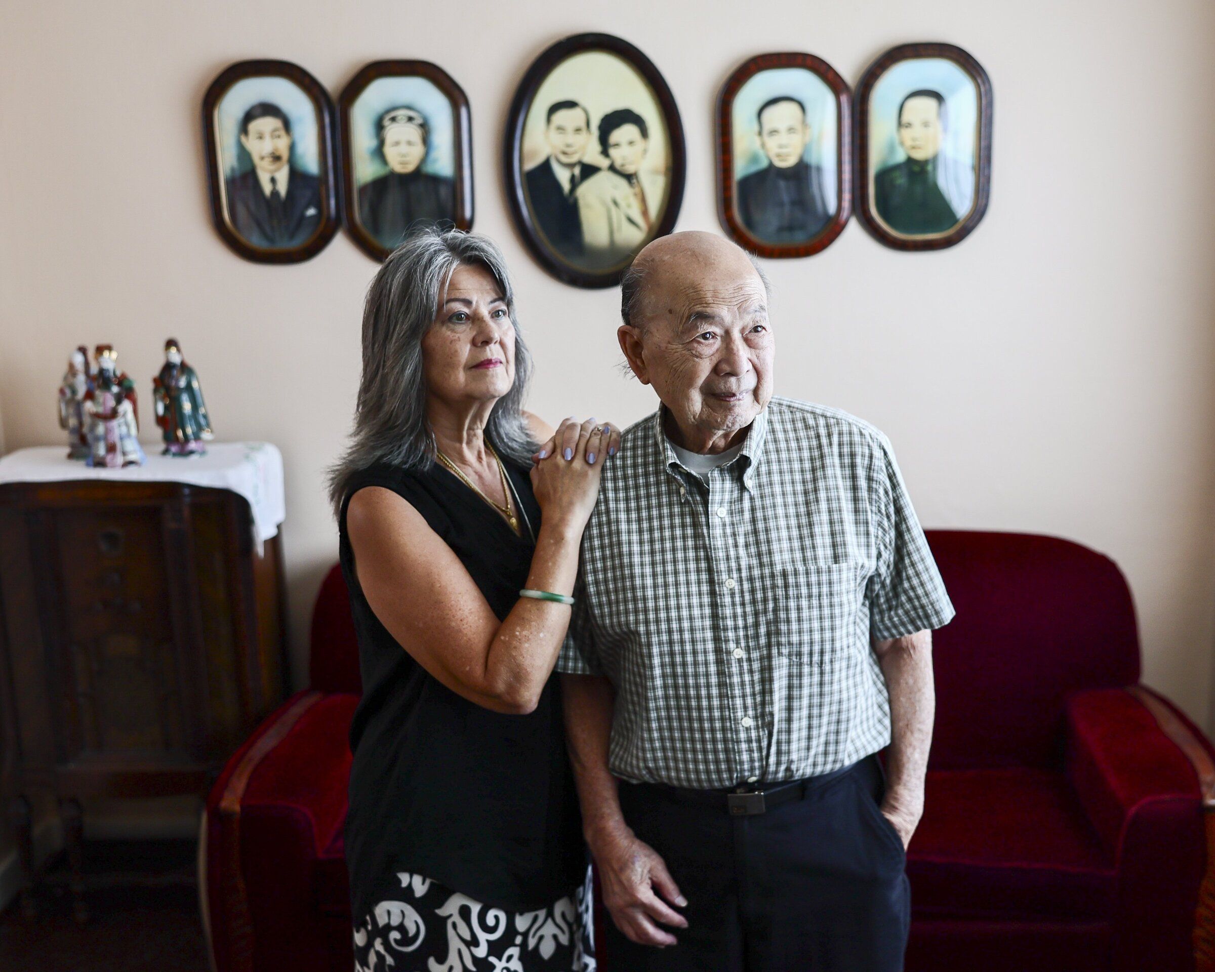 Sue-May Eng and Tuck Eng, granddaughter and son of the couple who built and lived in the Eng family home in the Chinatown International District, stand inside the 1937 house that the family partially sold and donated to the Wing Luke Museum. (Kevin Clark / The Seattle Times)