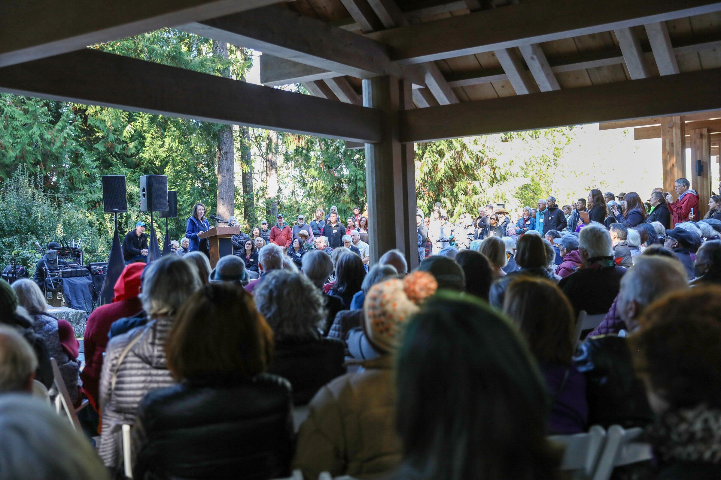 A crowd listens to U.S. Sen. Maria Cantwell during the opening of the visitor center for the Japanese American Incarceration Memorial on Bainbridge Island on Sunday. (Naomi Ishisaka / The Seattle Times)