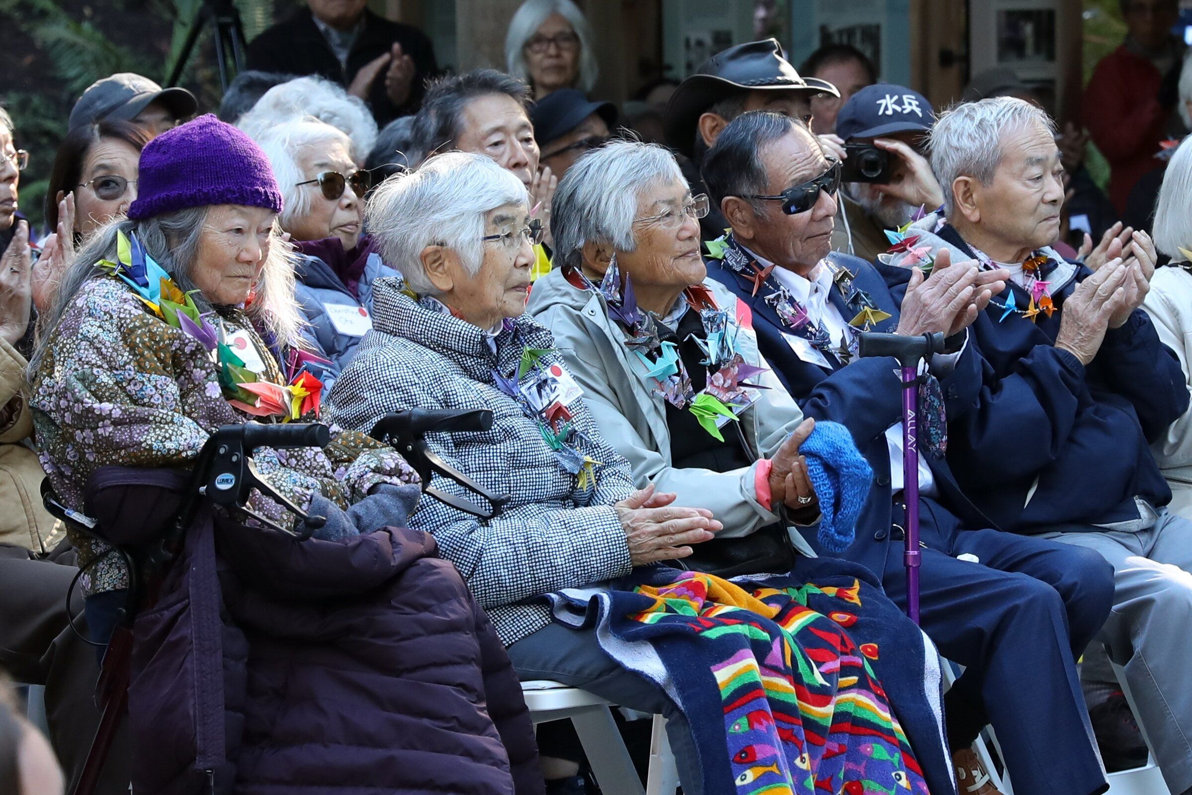 Japanese American incarceration survivors, from left, Hisako Matsudaira, Tomiko Hayashida Egashira, Yasuko Hayashida Mito, Gary Sakuma and Hiro Hayashida at the opening of the new visitor center for the Japanese American Exclusion Memorial on Bainbridge Island on Sunday. (Naomi Ishisaka / The Seattle Times)