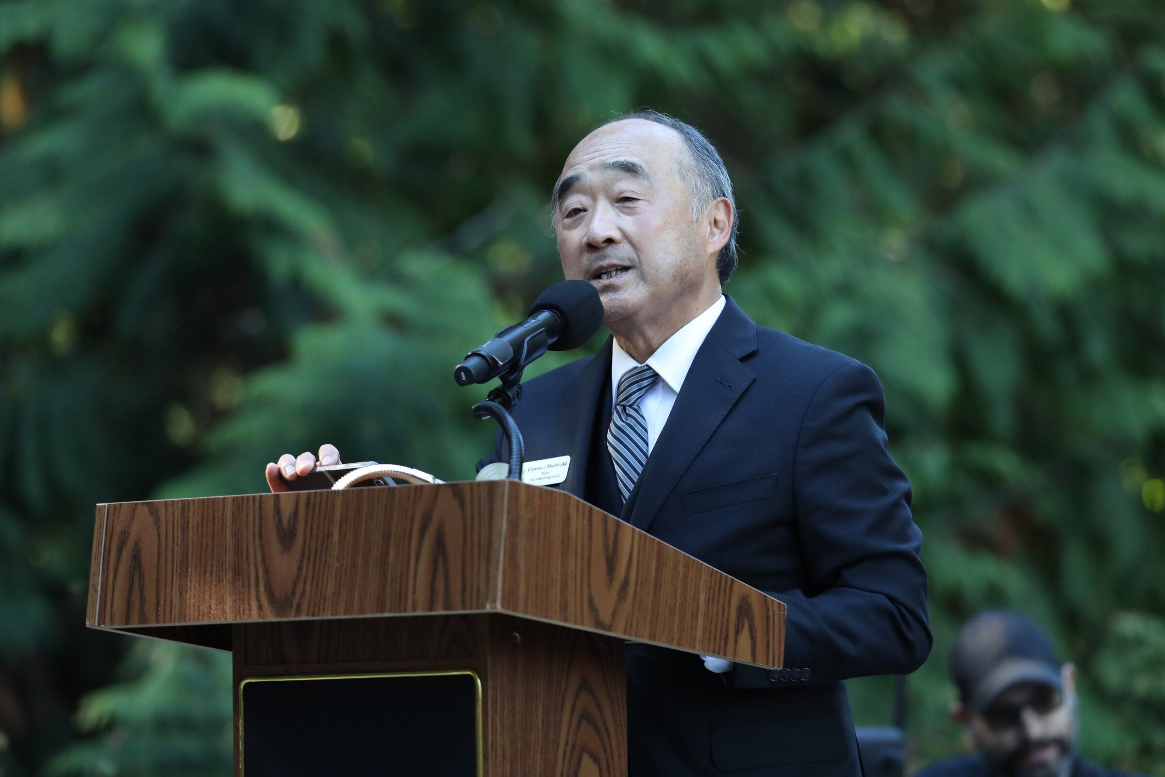 Bainbridge Island Mayor Clarence Moriwaki speaks during the opening of the visitor center for the Japanese American Incarceration Memorial on Bainbridge Island on Sunday. (Naomi Ishisaka / The Seattle Times)