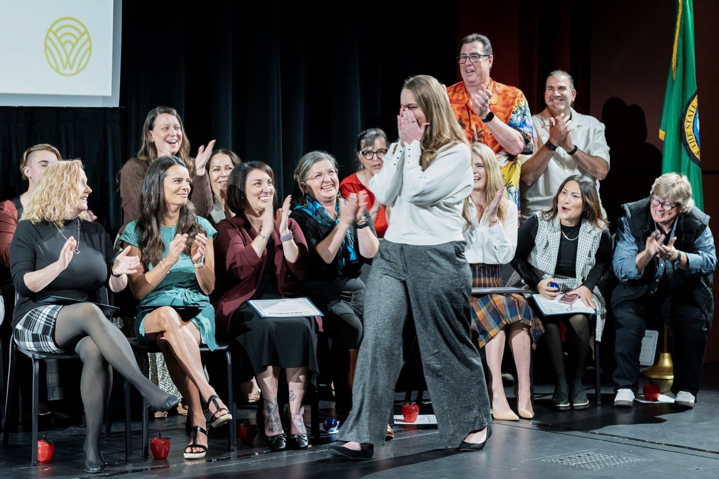 Kori Cannon, a multilingual learner kindergarten teacher at Westgate Elementary School, reacts after she is named Washington’s 2027 Teacher of the Year at  Educator of the Year Awards ceremony at Olympia’s Capital High School on Saturday. (Courtesy of Washington OSPI)