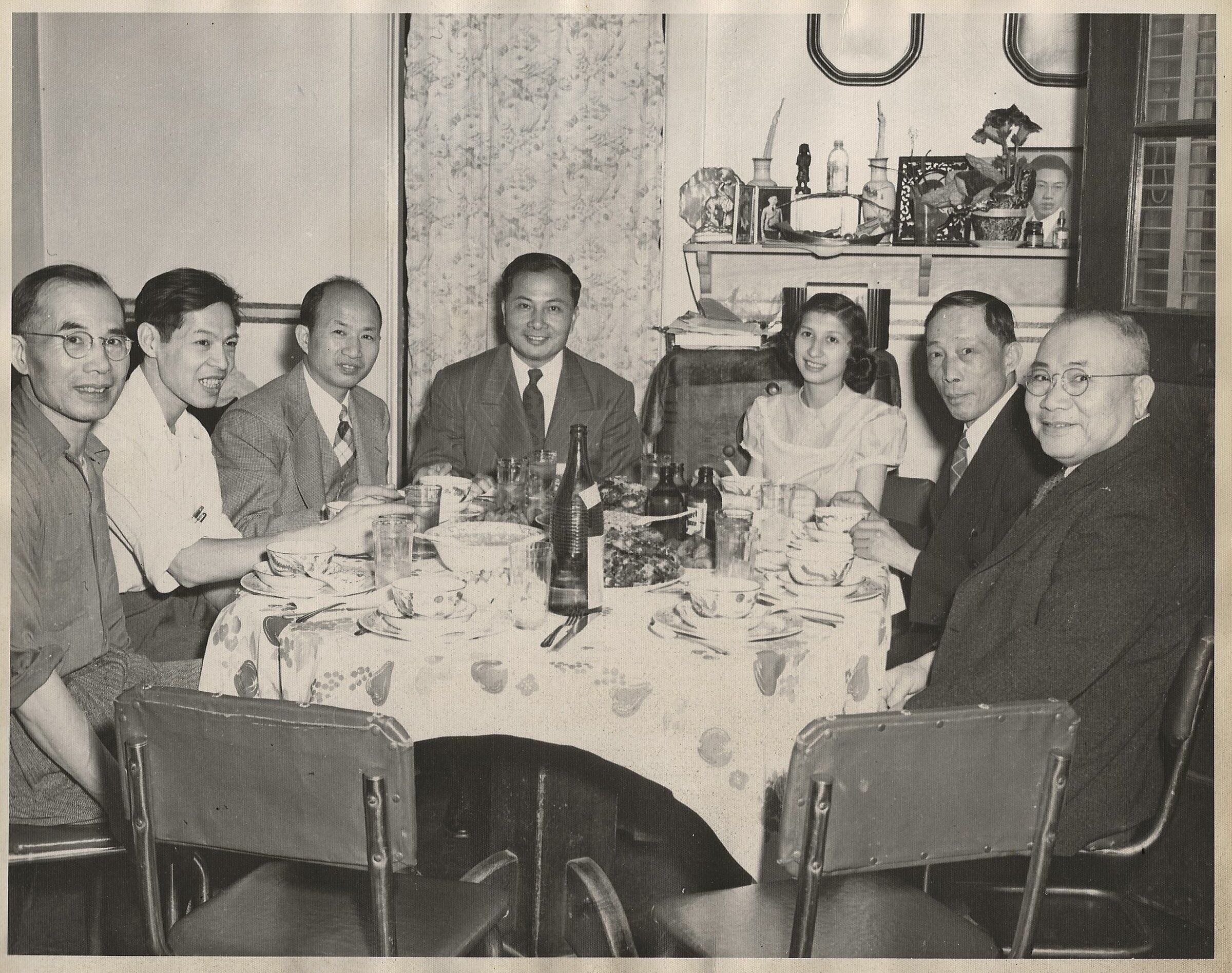 In 1949, Suen King Eng (left) has lunch with his cousins. (Courtesy of the Eng family)