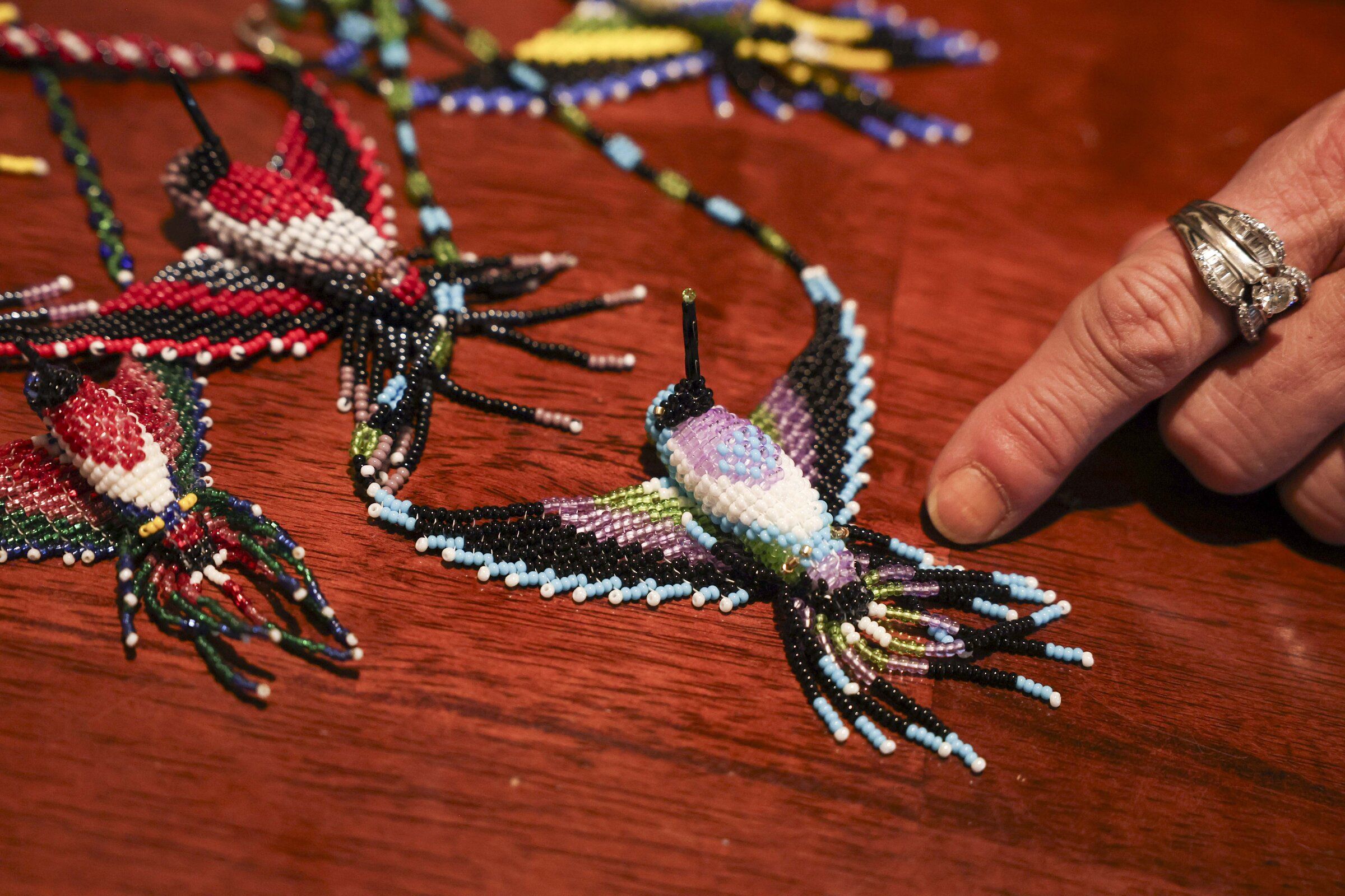 At her home in Tacoma, Ronelle Price keeps a collection of beaded birds her husband made in prison. (Ivy Seballo / The Seattle Times)