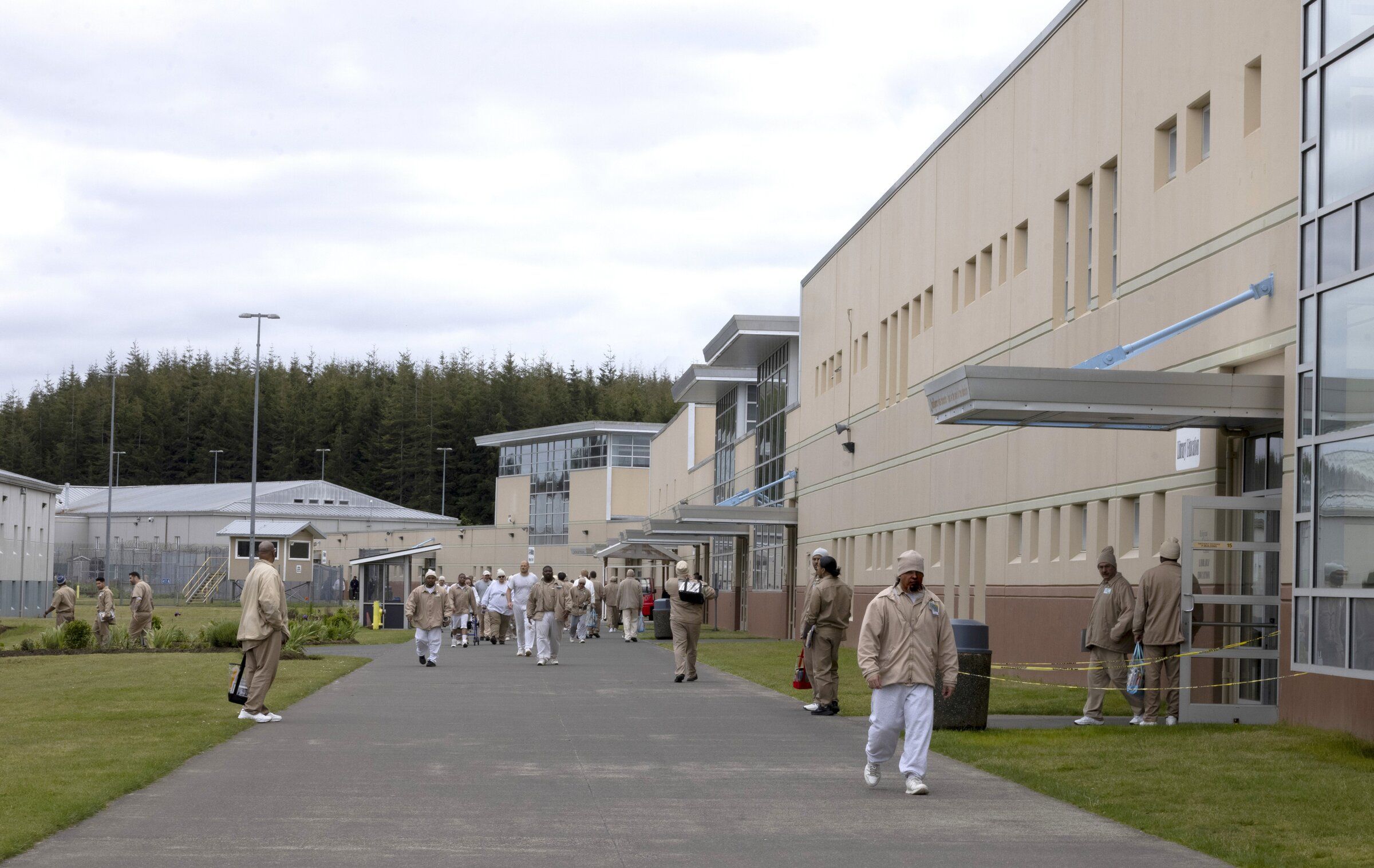 People walk around the grounds of Stafford Creek Corrections Center near Aberdeen, where Claude Price is incarcerated. (Ellen M. Banner / The Seattle Times)