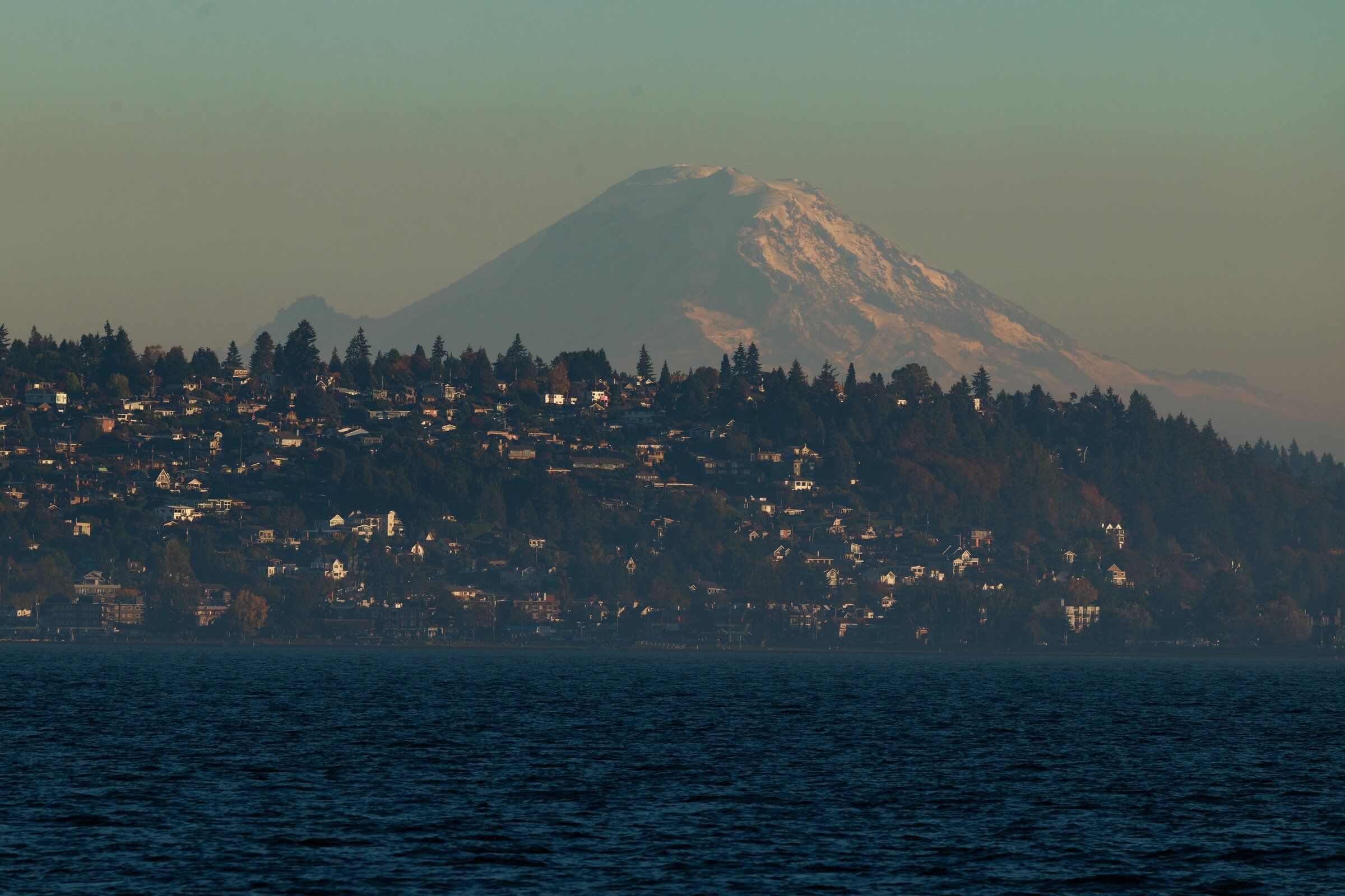 Evening light illuminates West Seattle and Mount Rainier Wednesday Oct 7, 2026. (Erika Schultz / The Seattle Times)