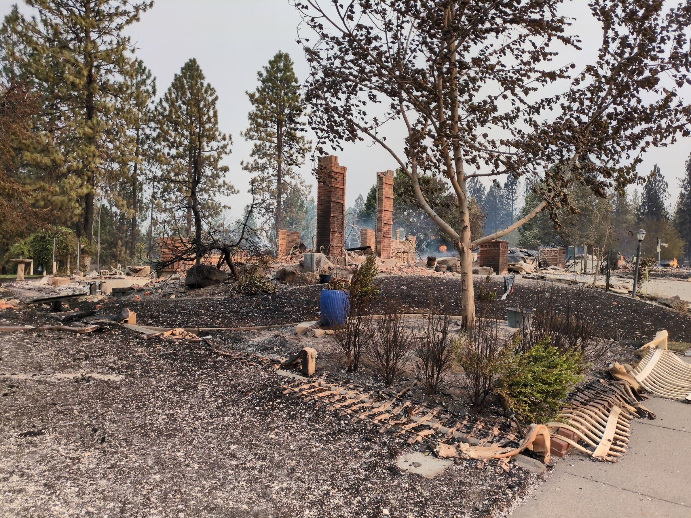 Brick columns were all that were left of Adam Morrison and his family’s home after the Spokane Complex Fires destroyed his entire neighborhood in August. He says homeowners like him should be allowed to build to older energy codes to lower rebuilding costs. Photo taken Aug. 3, 2026. (Courtesy of Adam Morrison / )