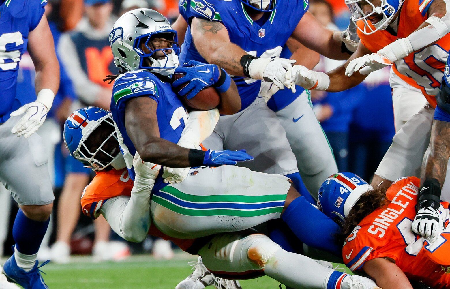 Seattle Seahawks running back Emanuel Wilson gets taken down near the line of scrimmage during the third quarter Thursday, Oct. 15, 2026 in Denver. 234296