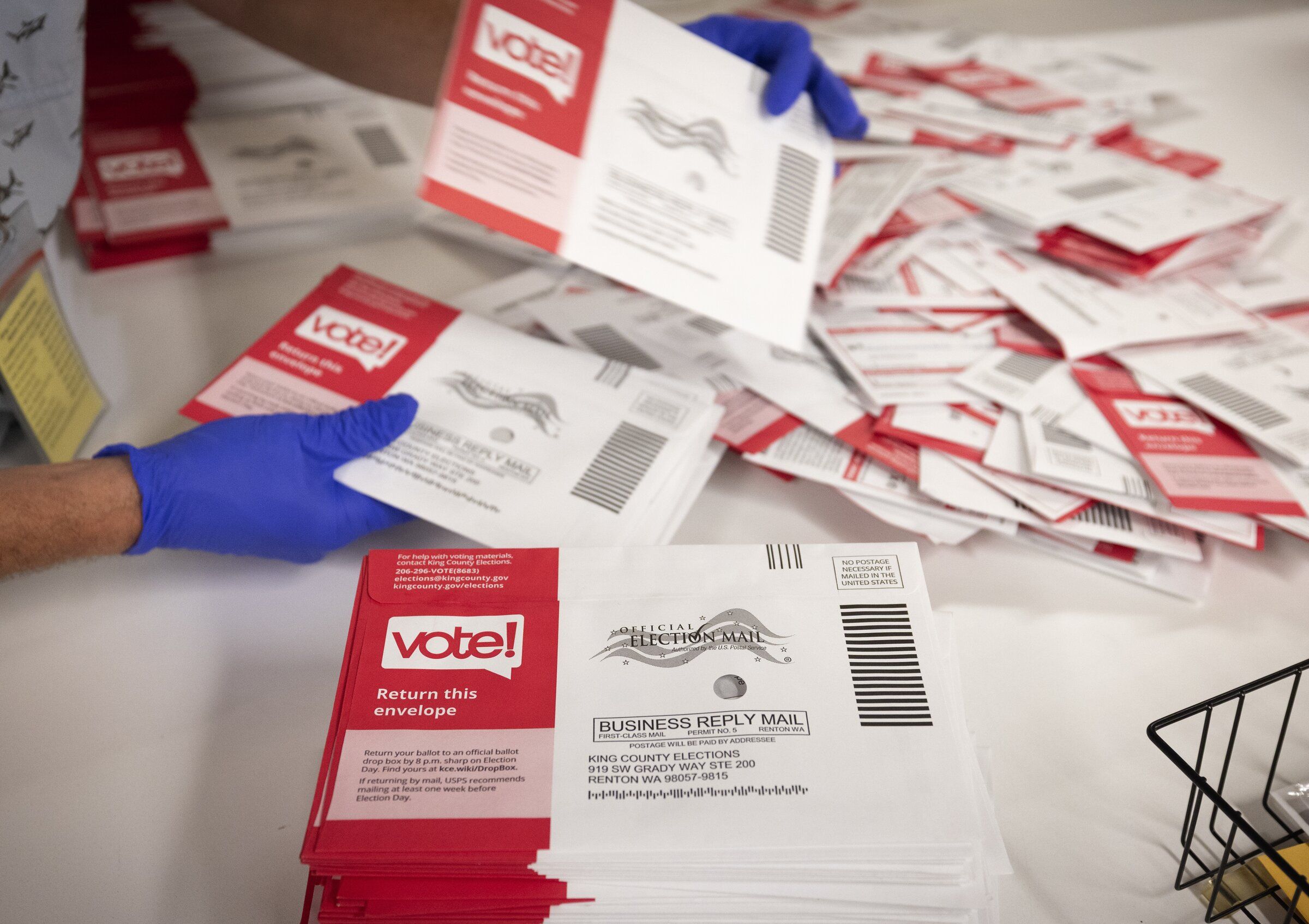 Primary election ballots are processed at King County Elections headquarters in Renton on Aug. 4, 2026. (Ken Lambert / The Seattle Times)