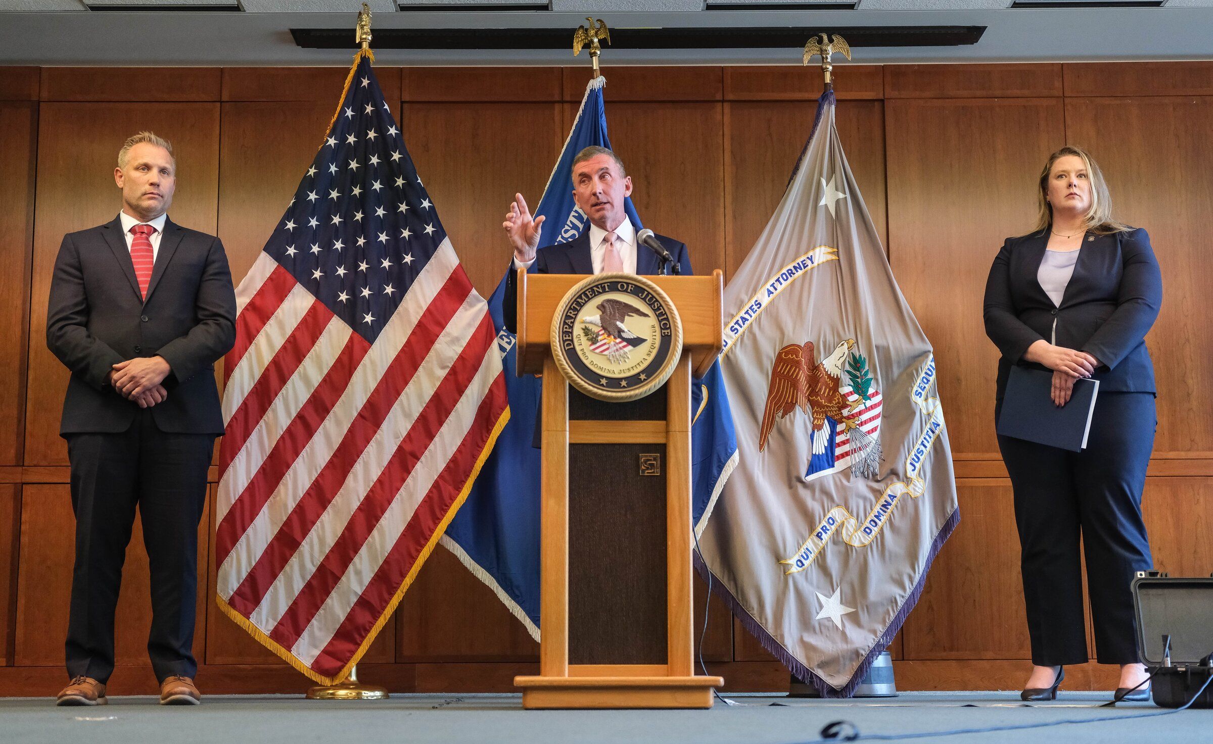Acting U.S. Attorney Neil Floyd for the Western District of Washington is flanked by , First Assistant U.S. Attorney Pete Serrano, and Acting Special Agent in Charge April Miller of HSI, in a press conference Monday in which they are seeking cooperation from the state on noncitizen voters they say are possibly voting illegally. 234747 (Dean Rutz / The Seattle Times)