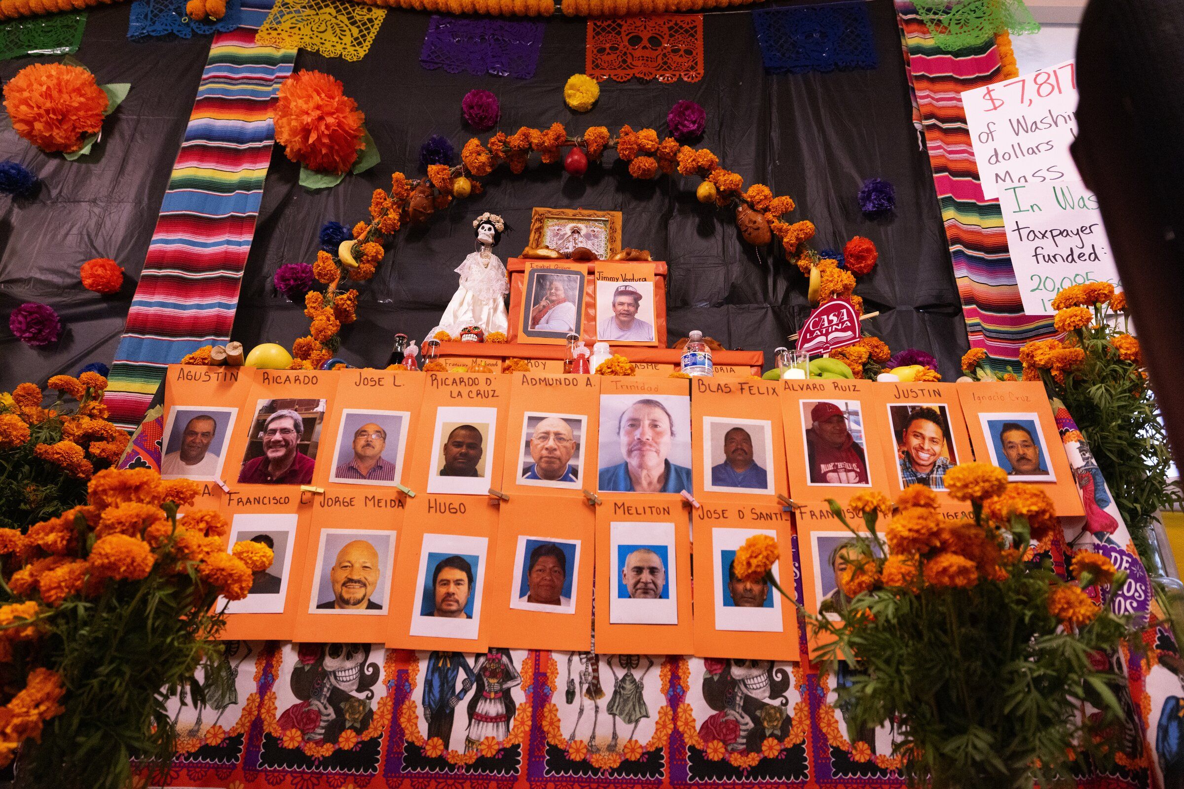 Photos of people who were detained or deported adorn an altar prepared for the upcoming Mexican holiday Día de los Muertos at Casa Latina. (Ken Lambert / The Seattle Times)