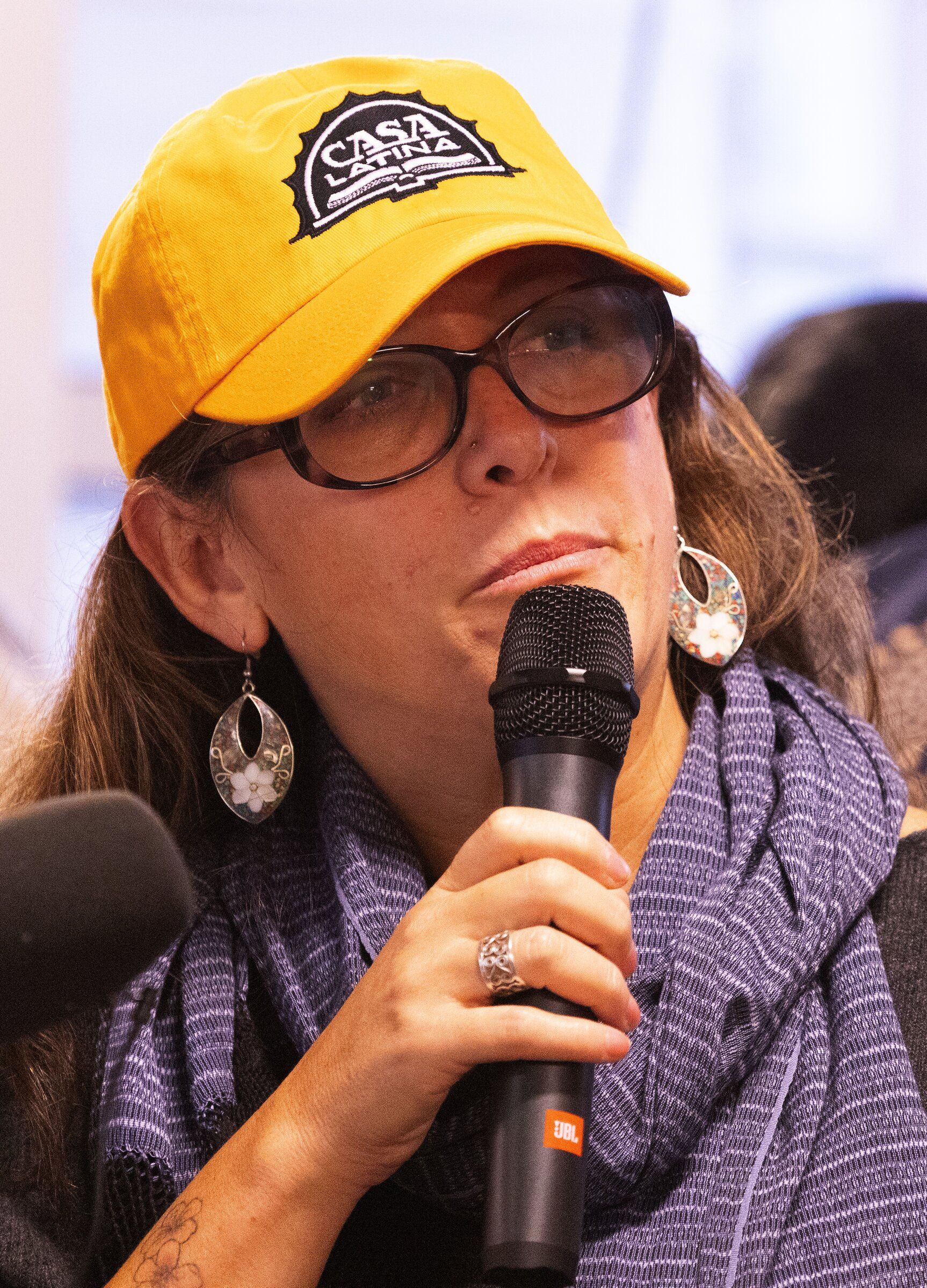 Palmira Figueroa speaks at a press conference Tuesday. As a member of the King County Immigrant and Refugee Commission, Figueroa takes part in a rapid-response group whose members go to places where ICE officers have reportedly been seen and arrests have taken place. (Ken Lambert / The Seattle Times)