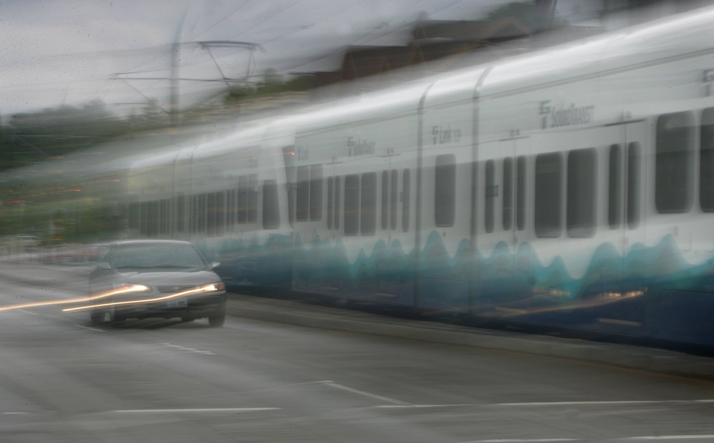 A car collided with a train Wednesday morning on MLK Jr. Way. (This 2010 file photo shows a light rail train heading north on MLK Jr. Way South.) (Ellen M. Banner / The Seattle Times)