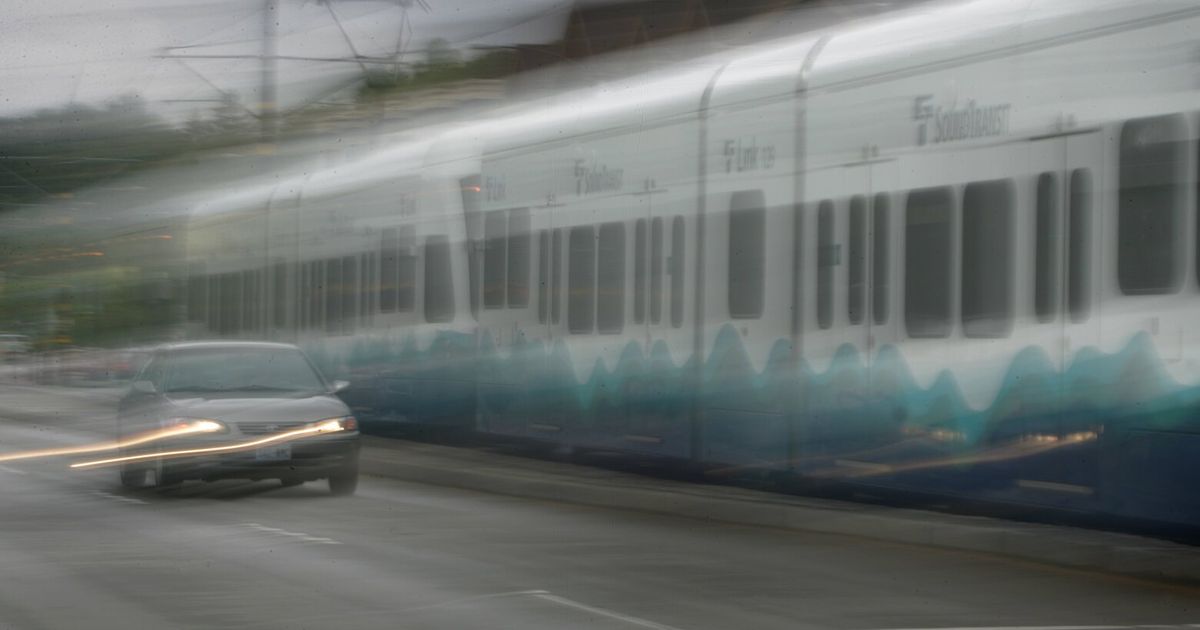 Light rail train, car collide in Seattle
