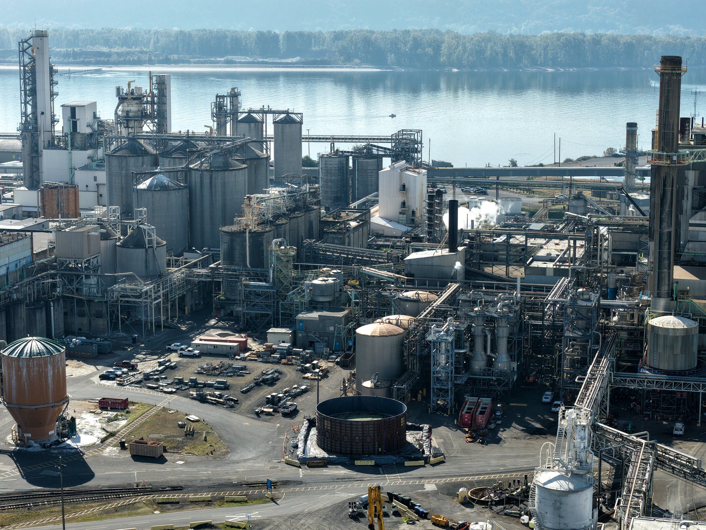 An aerial image of the Nippon Dynawave Packaging facility in Longview on October 16. A chemical tank failure on May 26 left 11 workers dead. (Karen Ducey / The Seattle Times)