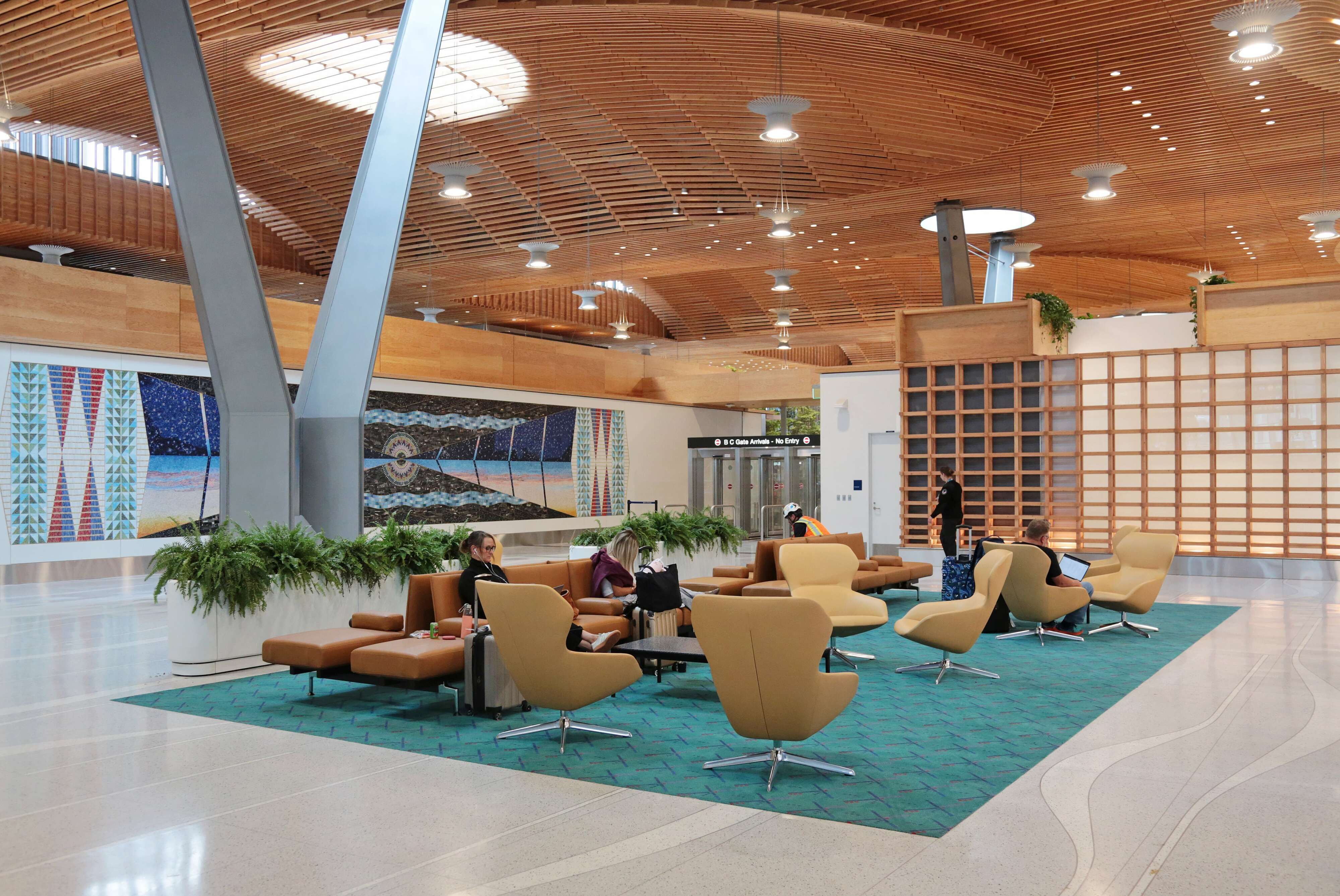 A new meetup area outside the B and C terminals at the Portland International Airport has comfortable chairs and features the old PDX carpet. (Jamie Hale | The Oregonian/oregonlive.com/TNS)