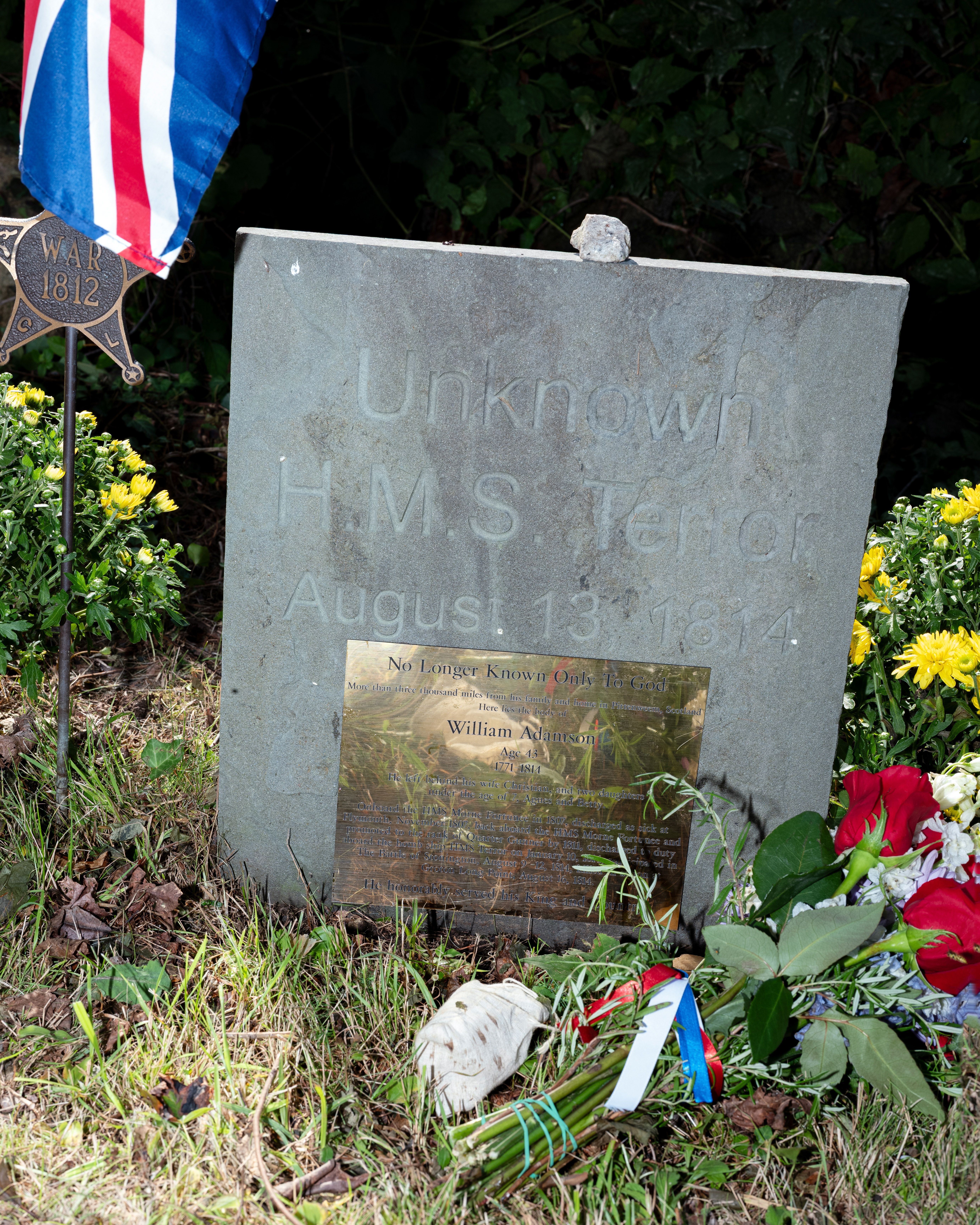 The grave of William Adamson, a Scottish sailor killed on the coast of Connecticut during the War of 1812, in Mystic, Conn., on Aug. 23. The grave was unmarked