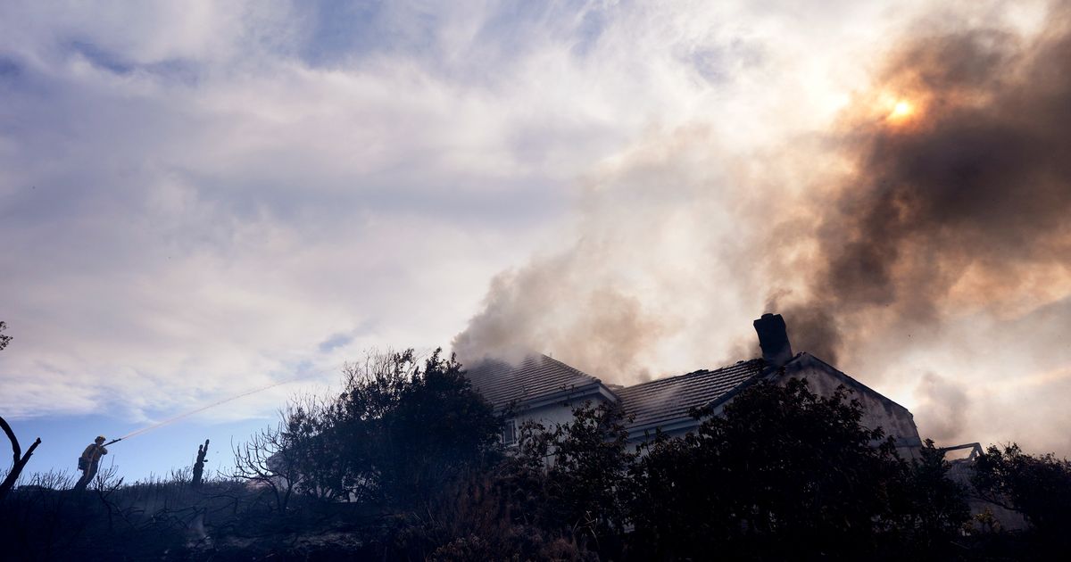 Fire crews battle Southern California blaze that burned 6 homes, led to the evacuation of 16,000