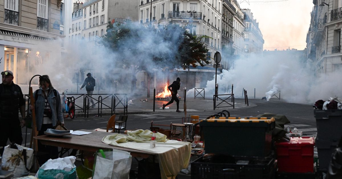 Macron rejects interior minister’s resignation as rioting and looting expose policing failures