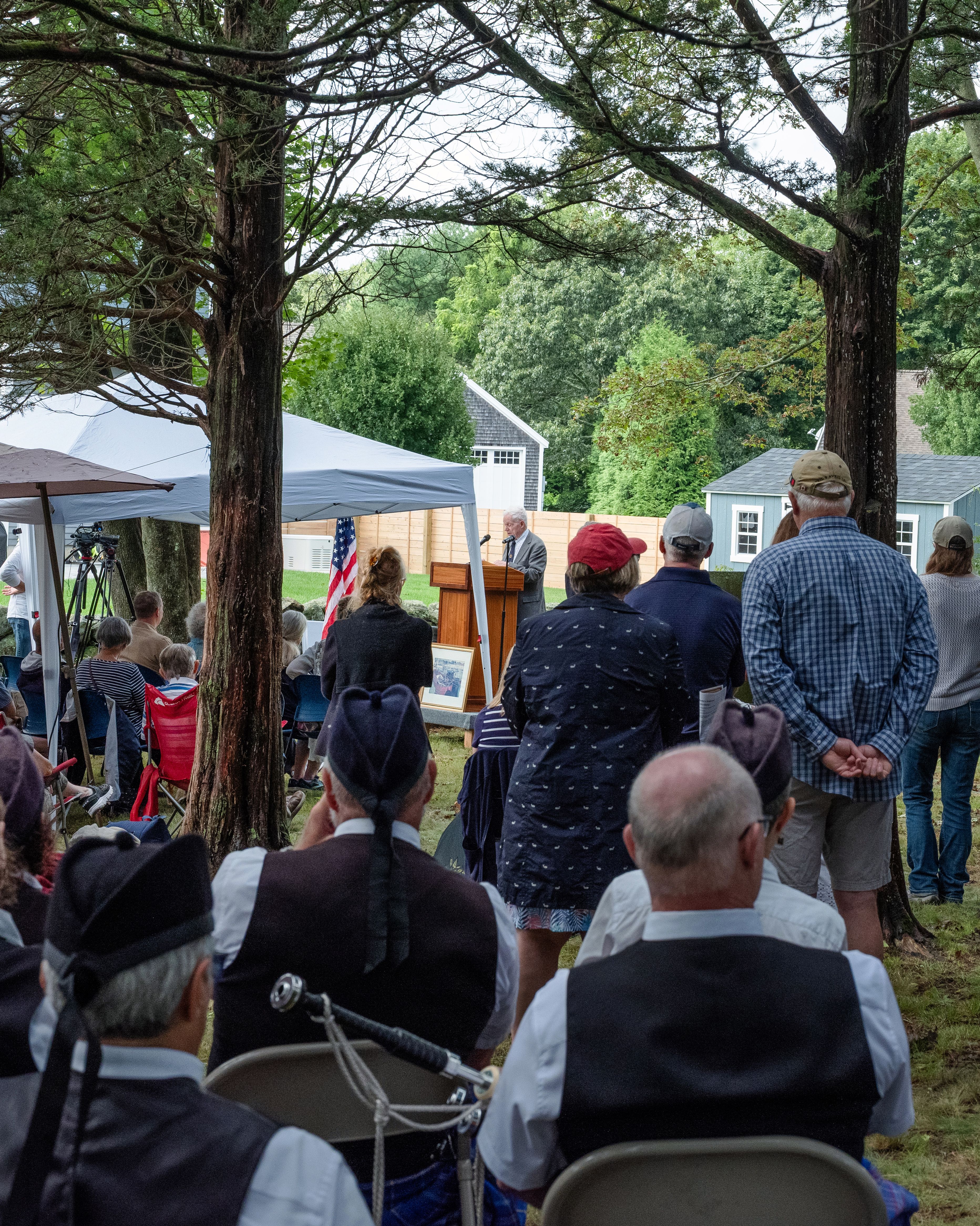 People gather for a ceremony at Packer Cemetery in Mystic, Conn., on Aug. 23. (Sarah Meftah / The New York Times)